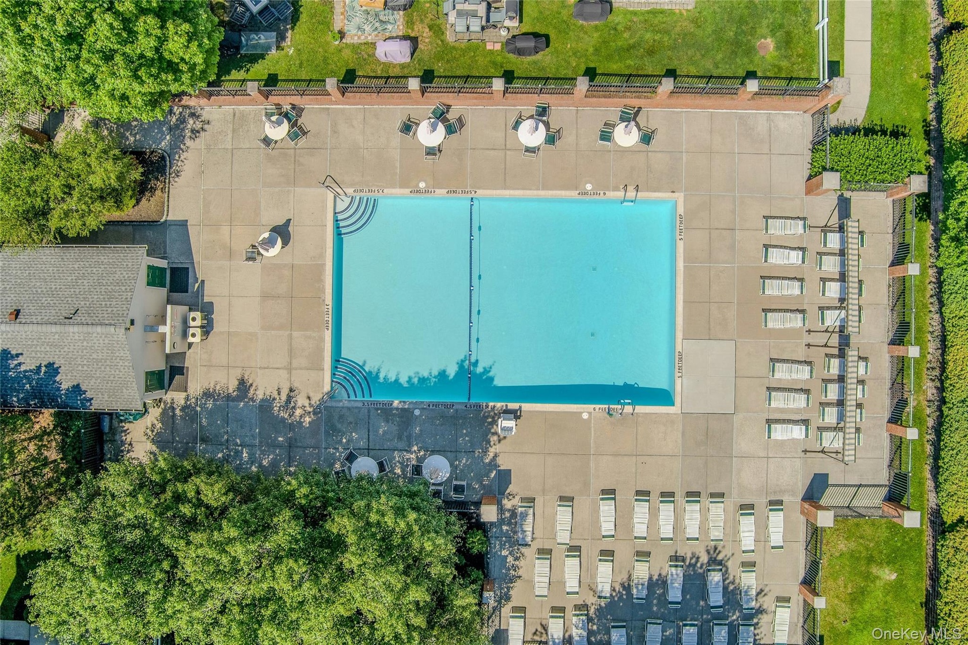 Center of community boasts large swimming pool supervised by lifeguard