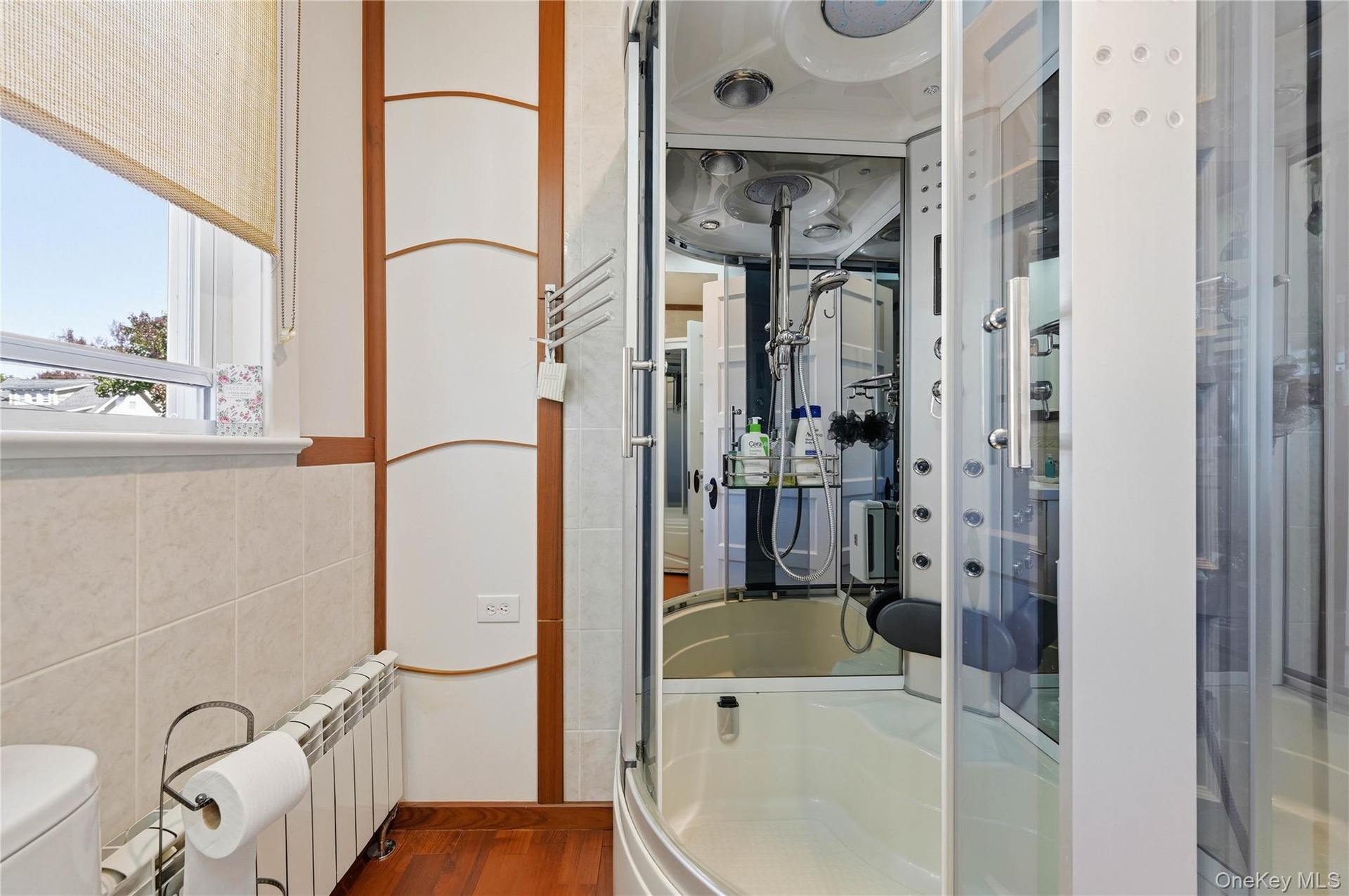 The shower enclosure features a built-in sauna function