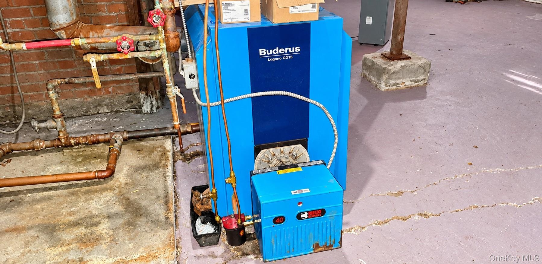 Buderus Logano G115 boiler with copper piping and integrated burner system