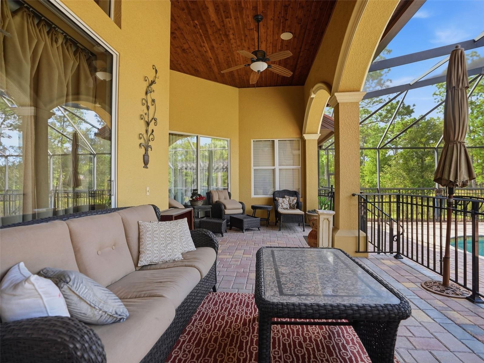 The architecture on the home is in every detail! Triple arches, wood plank tongue and grove ceilings!