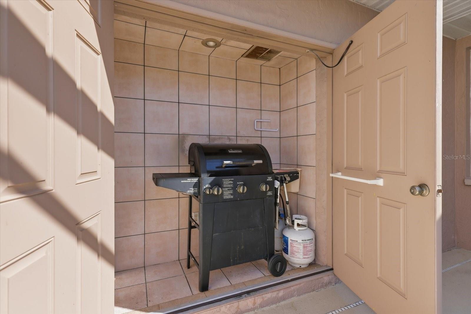 grill storage with double doors.
