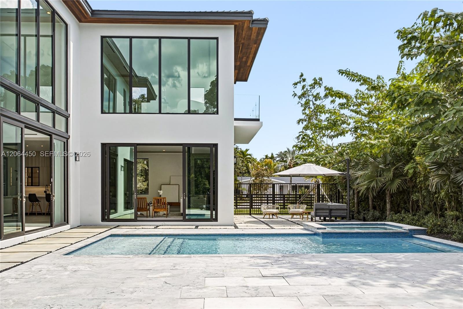 Rear elevation with covered terrace and resort style pool