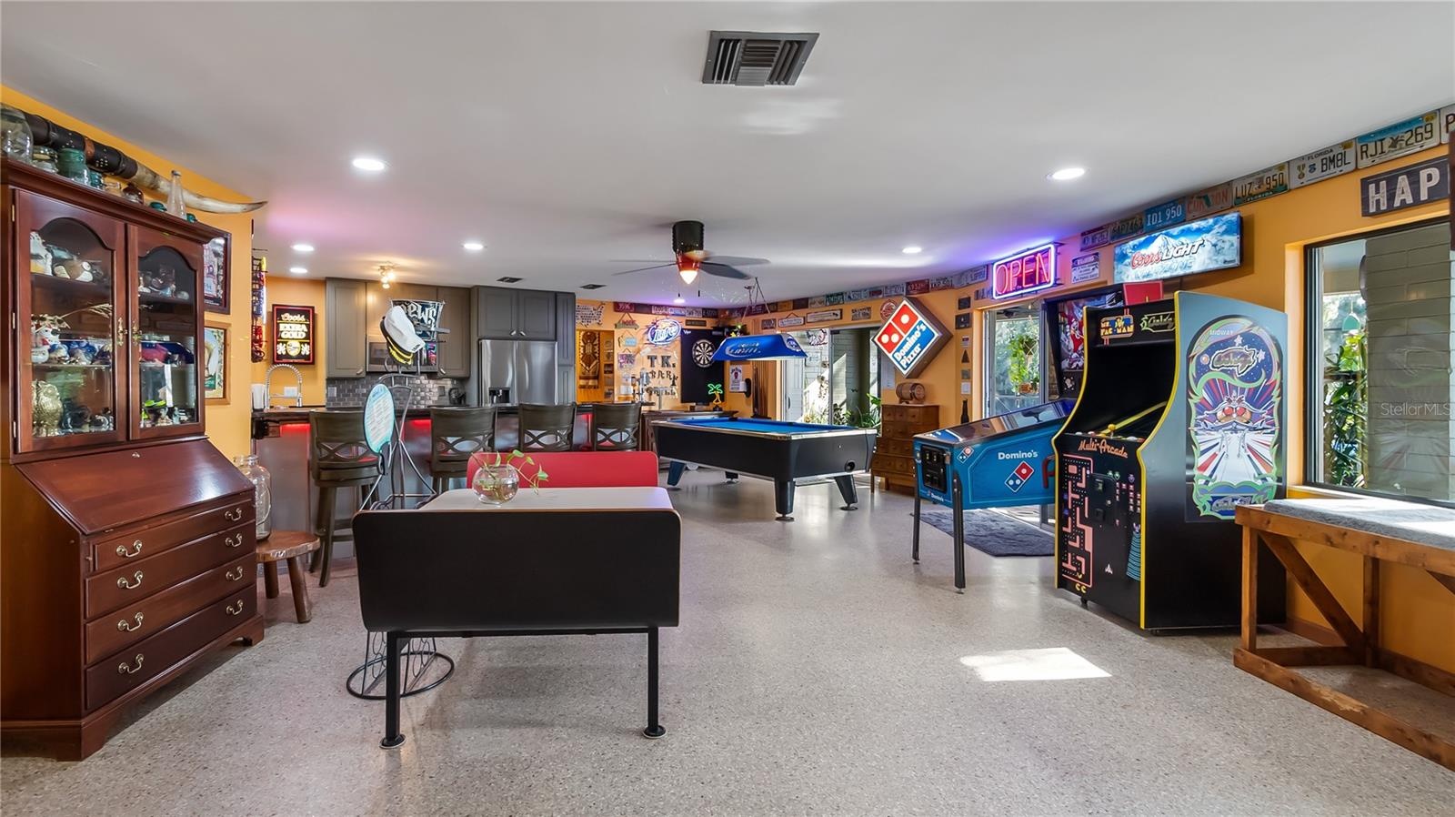 Main Home - Great room/kitchen/living room combo: Living room used as gathering space for game room fun. Two Sliders go out to covered back porch and 