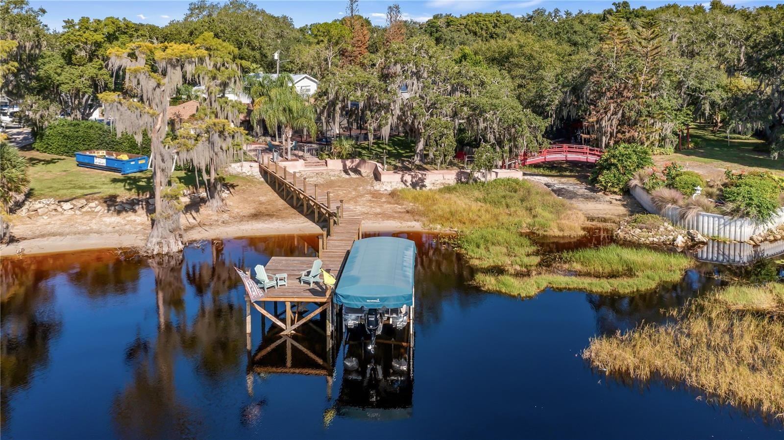 Aerial from lake Minnehaha of 1730 Nita Place Clermont, FLResurfaced Seawall in 2026, Renovated Dock platform 10/2022, Renovated Dock walkway 5/2026