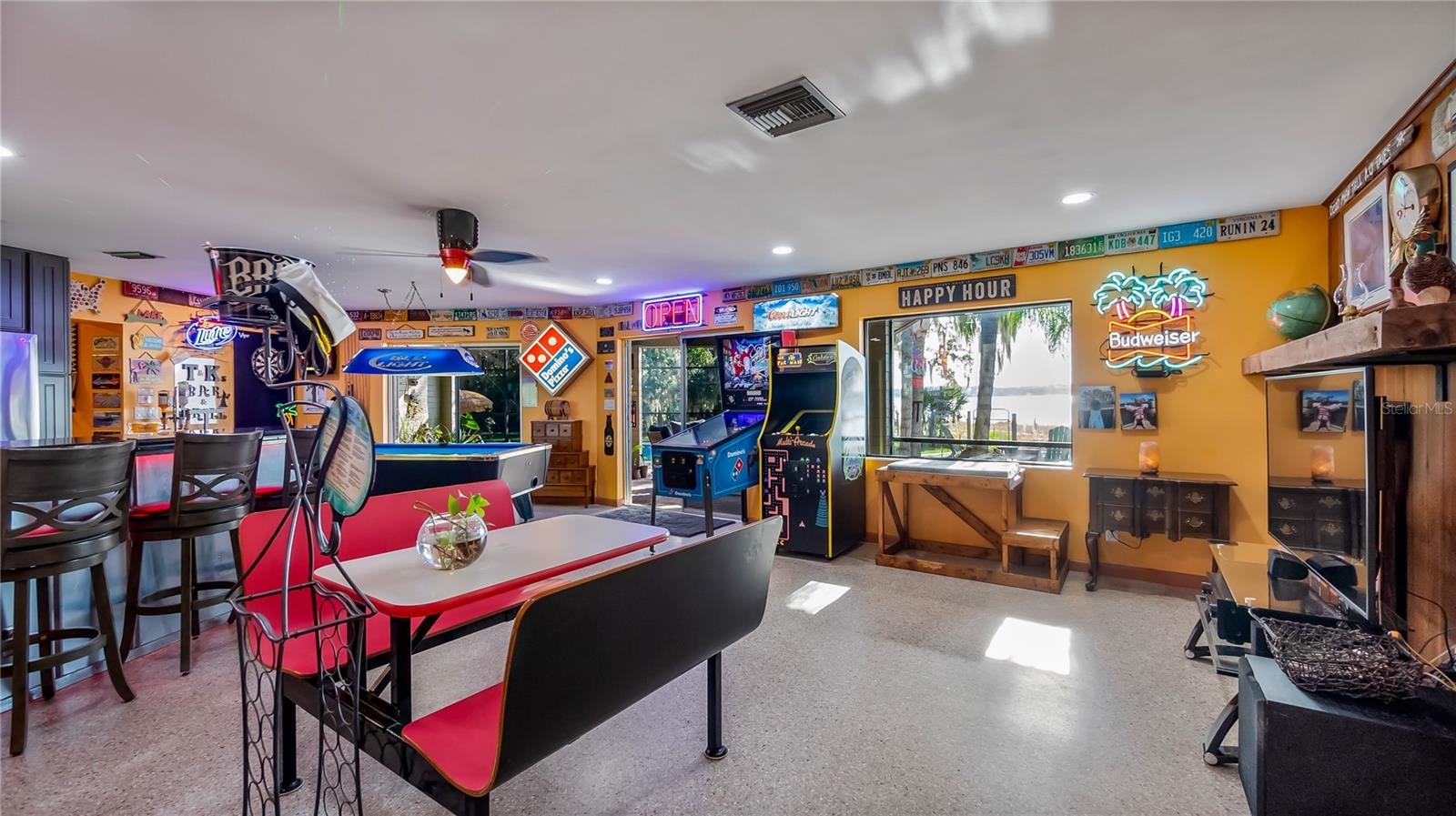 Main Home - Great room/kitchen/living room combo: Living room used as gathering space for game room fun. Two Sliders go out to covered back porch and 