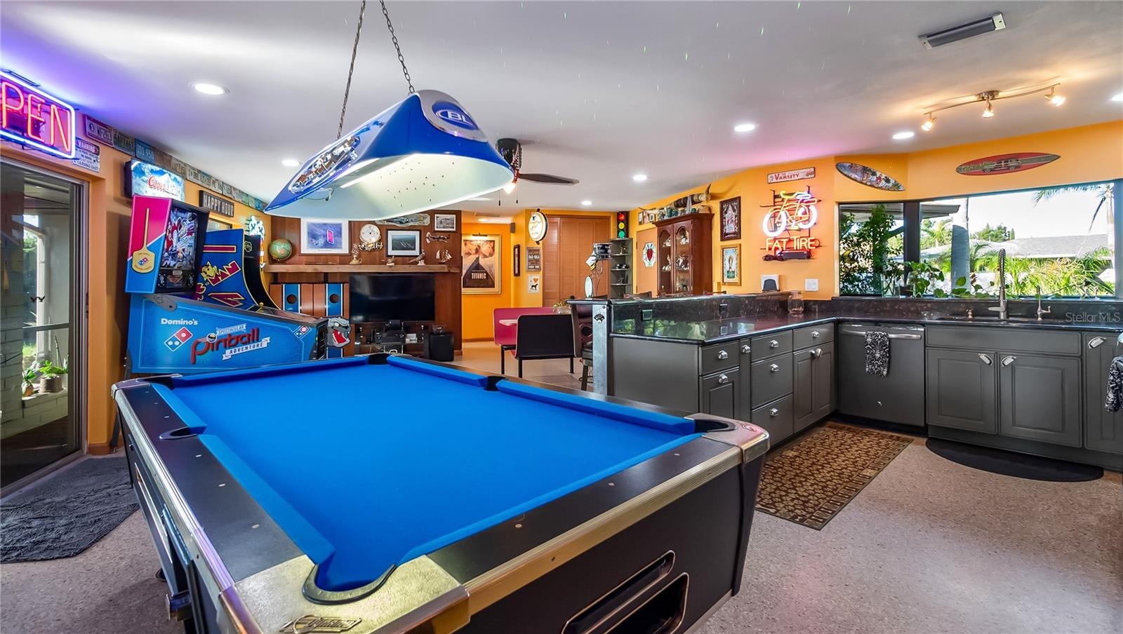 Main Home - Great room/kitchen/living room combo: Living room used as gathering space for game room fun. Two Sliders go out to covered back porch and 