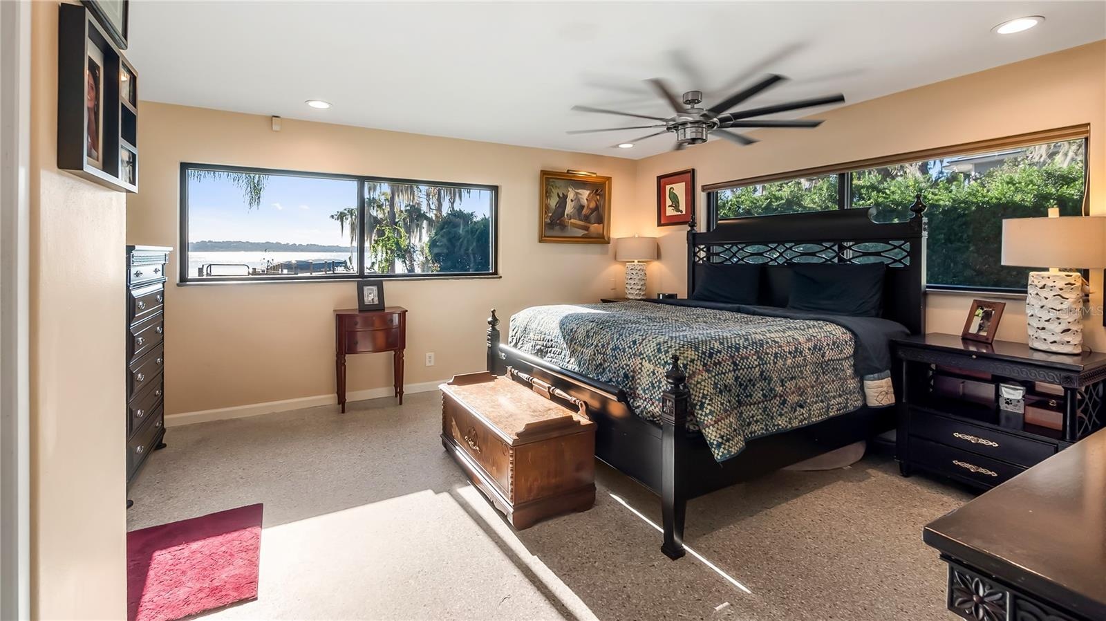 Primary with private bath and amazing lakefront views