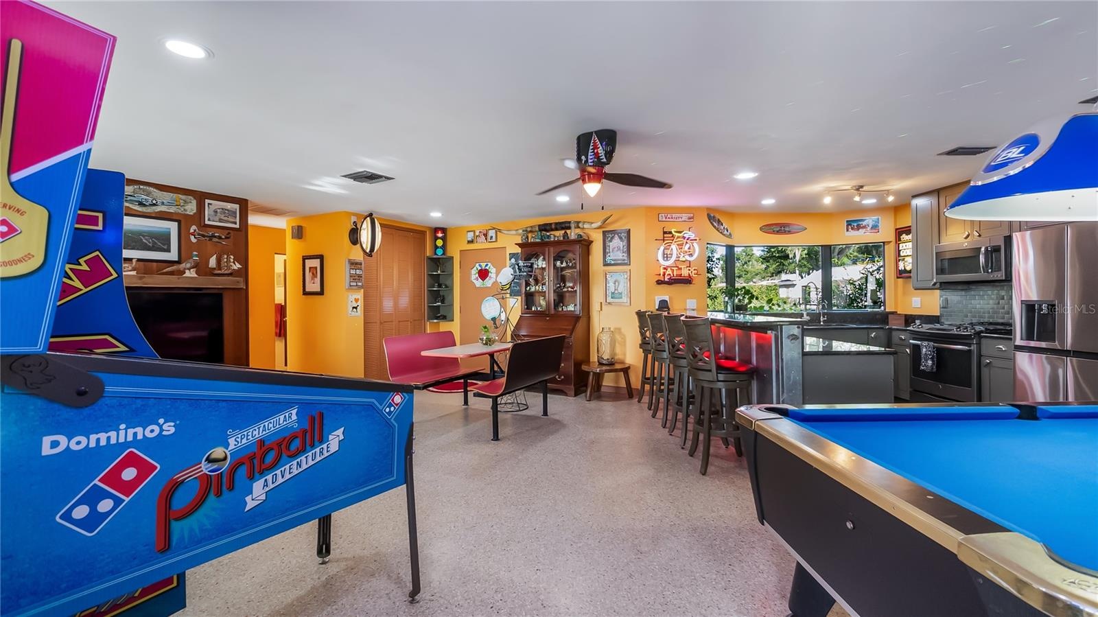 Main Home - Great room/kitchen/living room combo: Living room used as gathering space for game room fun. Two Sliders go out to covered back porch and 