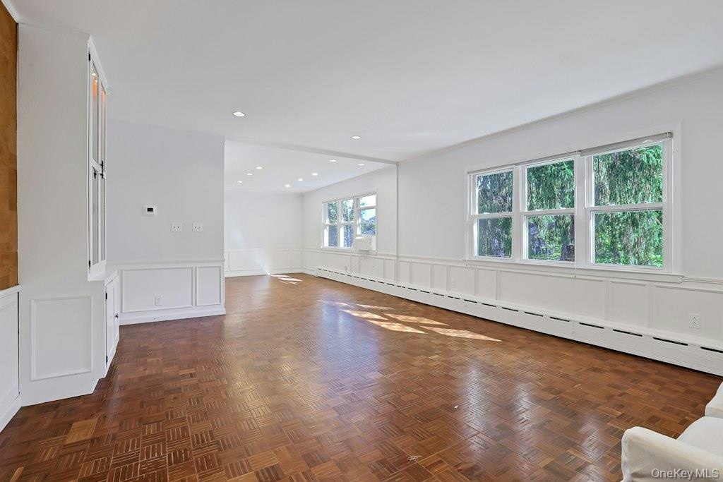 Second Floor Main Room, large windows, recessed lighting.