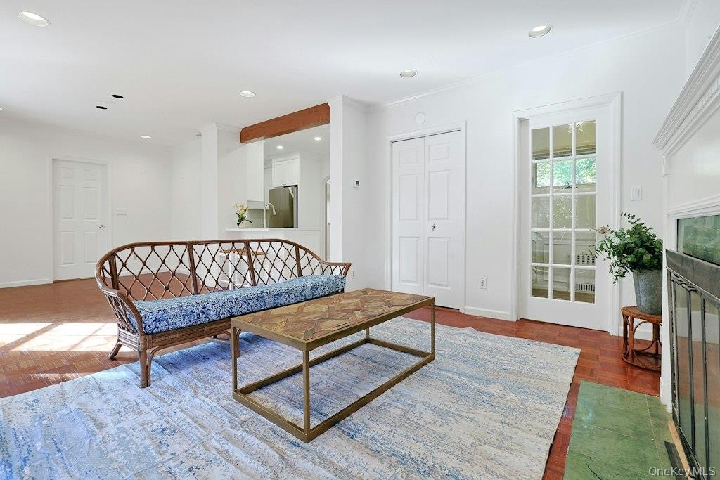 1st Fl LR, facing French door to second floor and second entry.