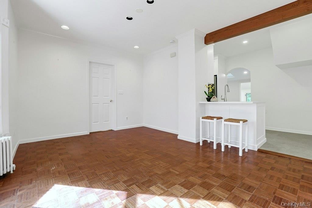 1st Fl Dining area, facing door to Primary Bedroom. Warm wood floors