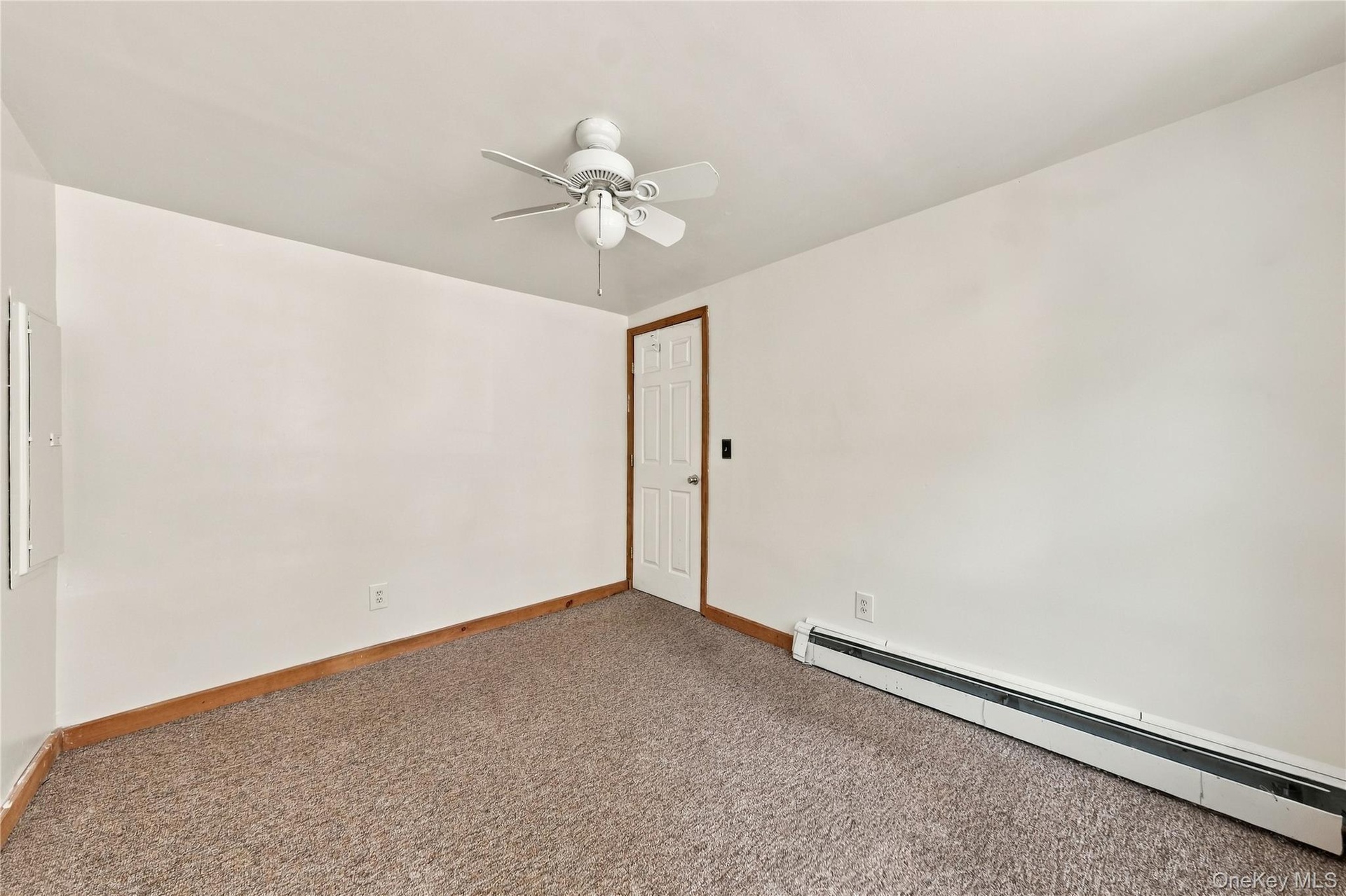 Freshly painted  bedroom featuring neutral wall-to-wall carpeting