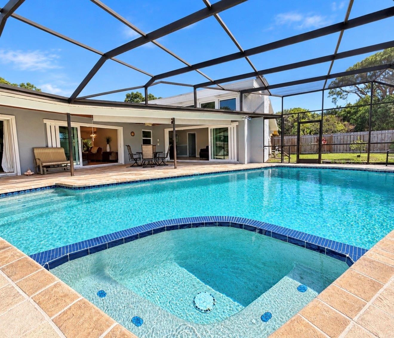 Screened Enclosed pool with spillover spa