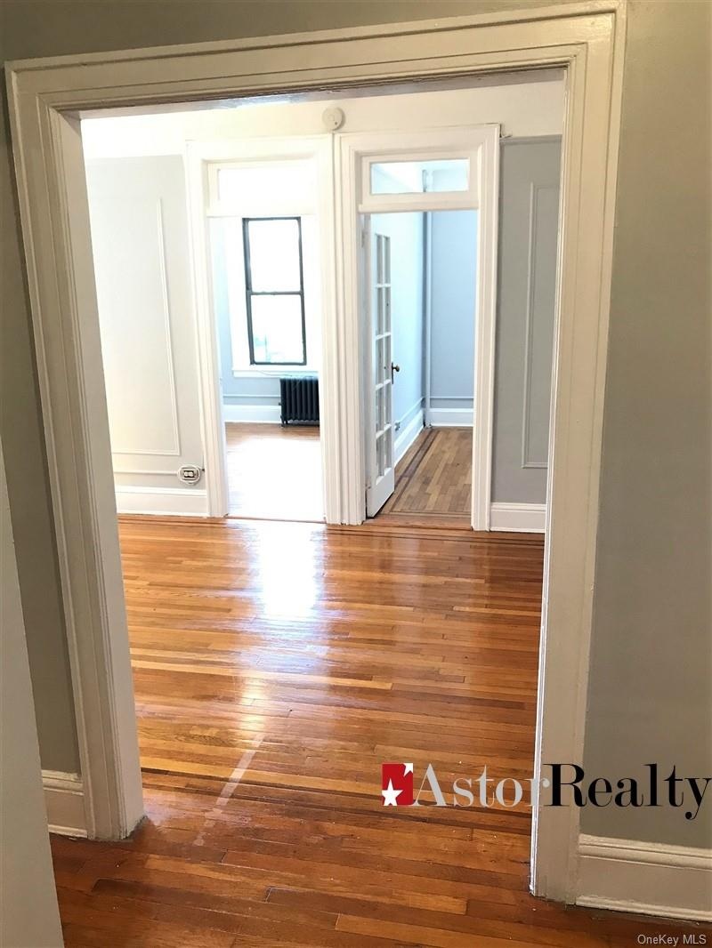 Unit 1R/2 Bedroom Foyer looking into living room w/kitchen entry on left