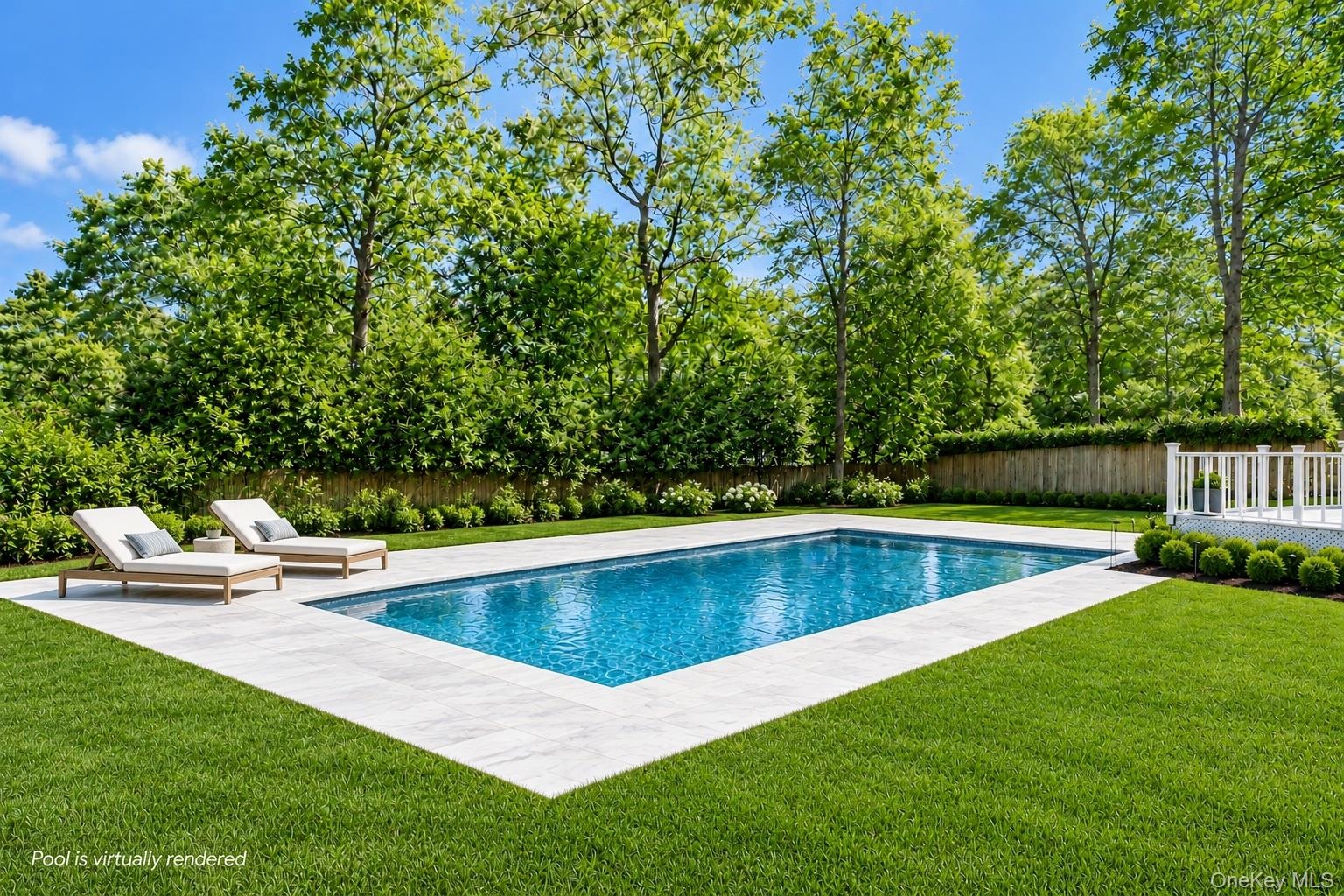 Rectangular inground pool with stone coping, expansive manicured lawn, perimeter fencing, and mature trees