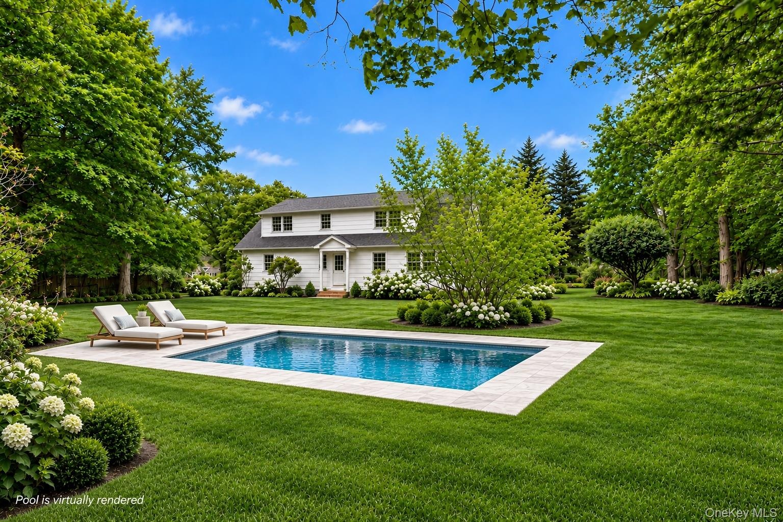Expansive backyard featuring a rectangular in-ground pool, stone pool deck, meticulously manicured lawn, and mature trees