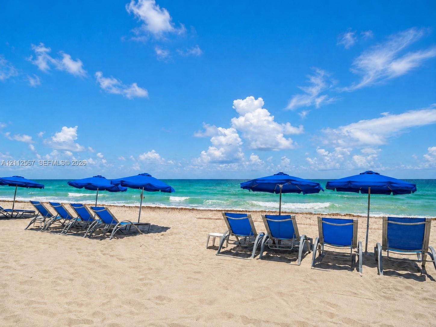 Direct beachfront access with expansive sandy shoreline and ocean waters