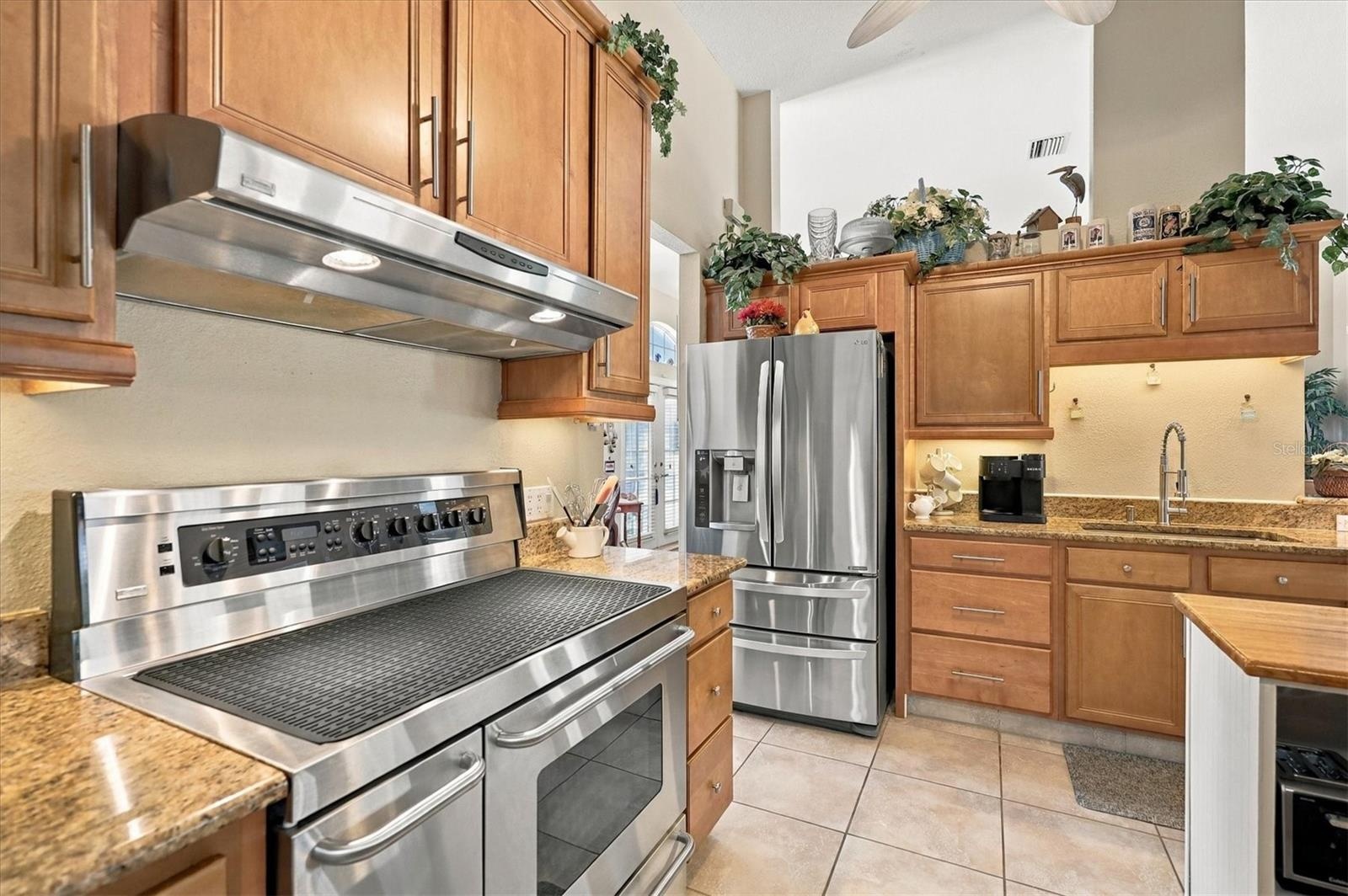 Stainless appliances, and range has a side convection oven.