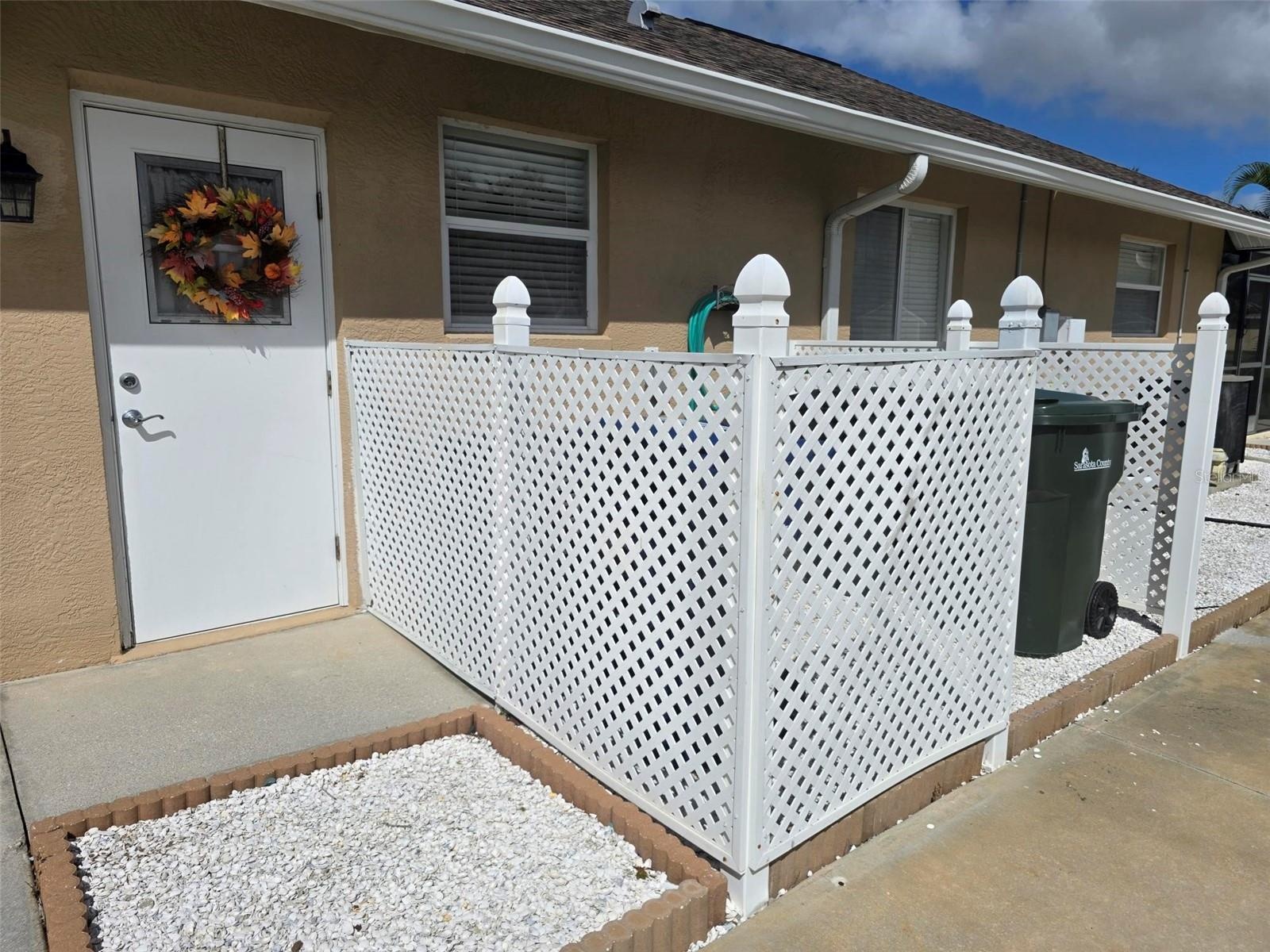 Dedicated area for cans, and side garage entry.