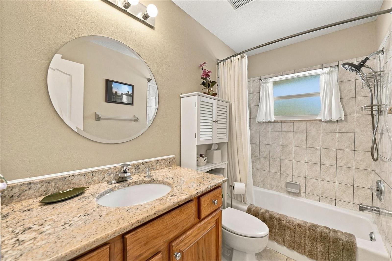 Bath 2, located by pool access.