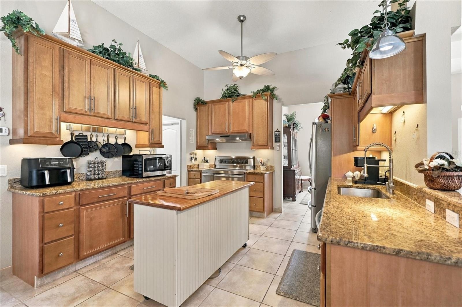 Plenty of cabinetry, and island has electric.