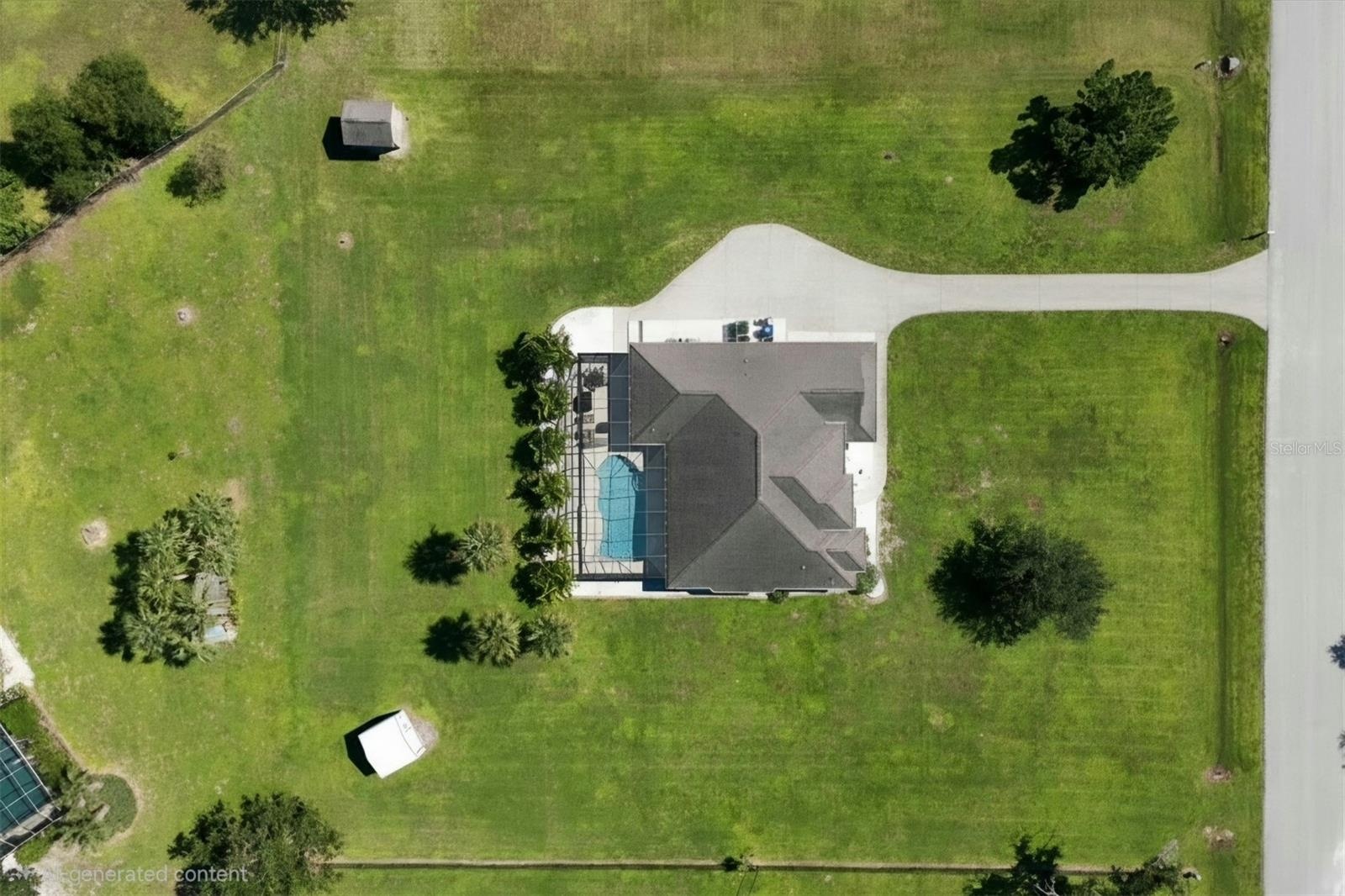 Rear lot line is about the darker green swale line behind the sheds.