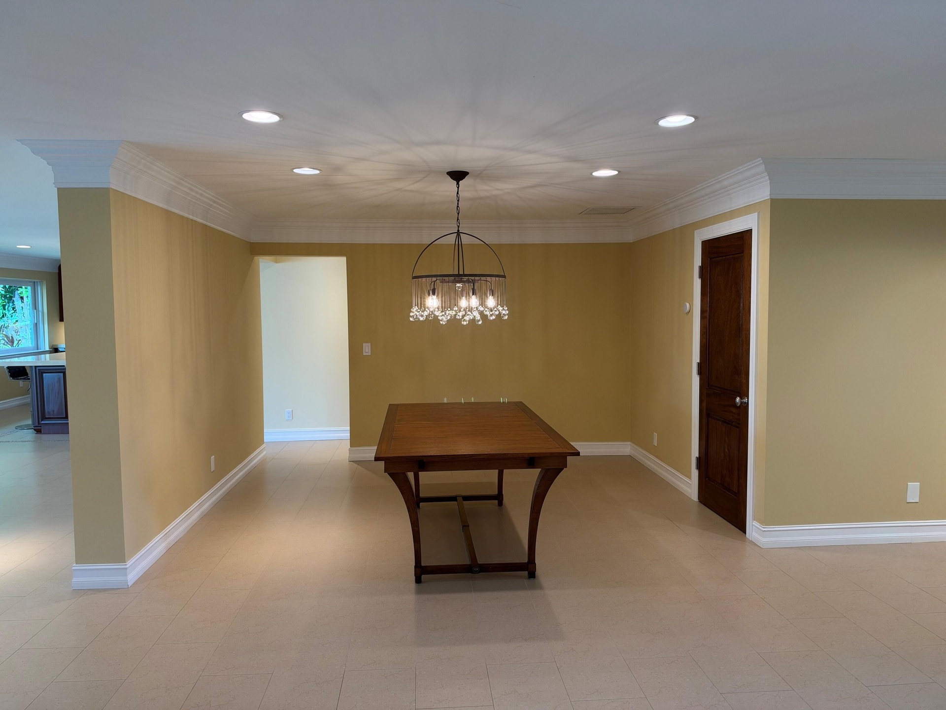 Elegant formal dining with glass chandelier