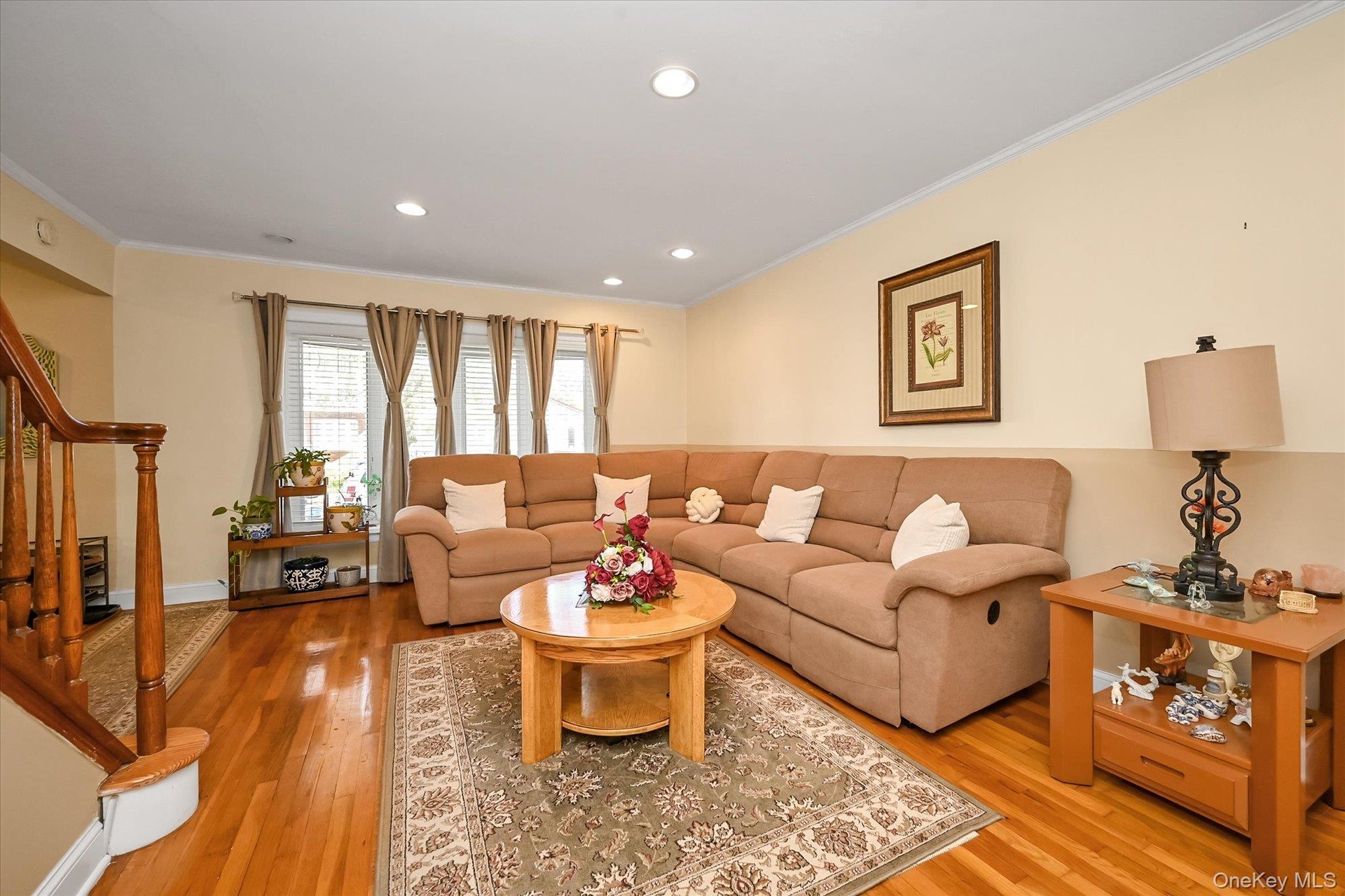 Large Living room With beautiful hardwood floors, recess lighting.
