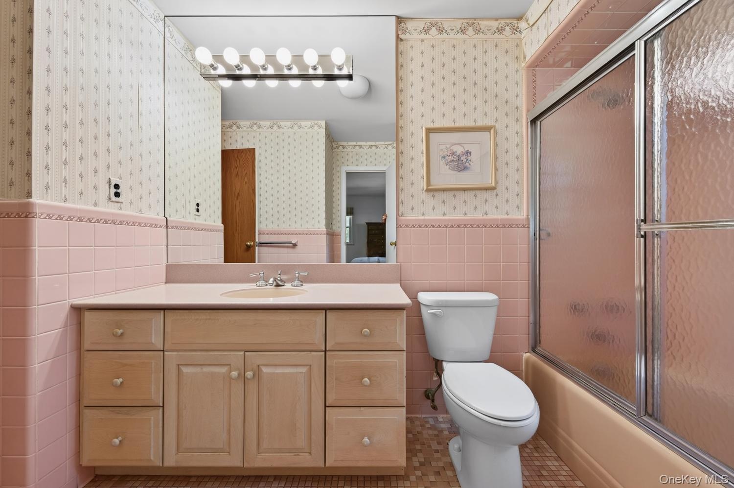 Bathroom with door to primary bedroom and hallway