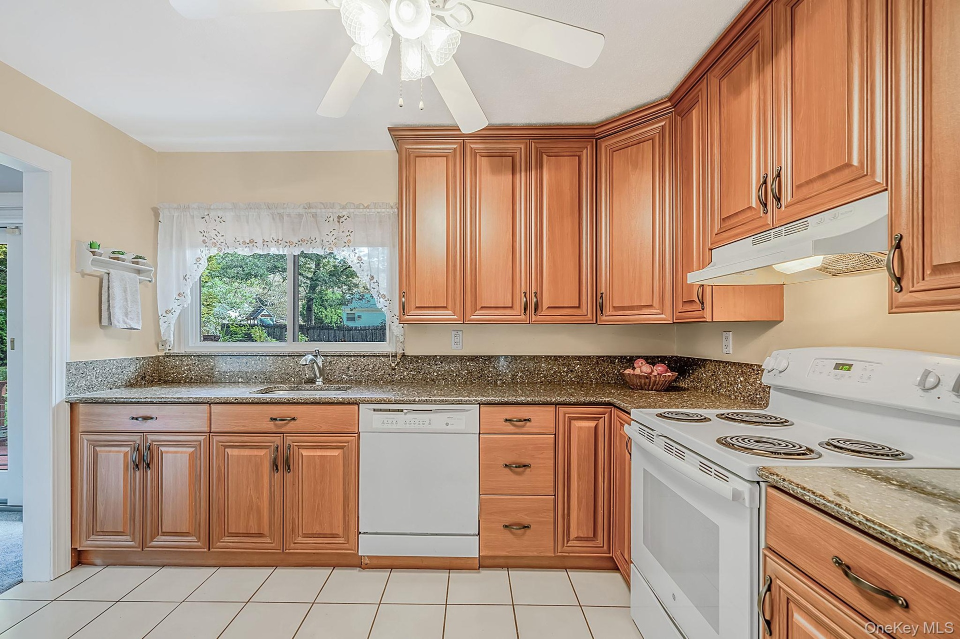 EIK with Beautiful Cabinetry, Granite Countertops, Window Overlooking The Yard, Open to DR and Den