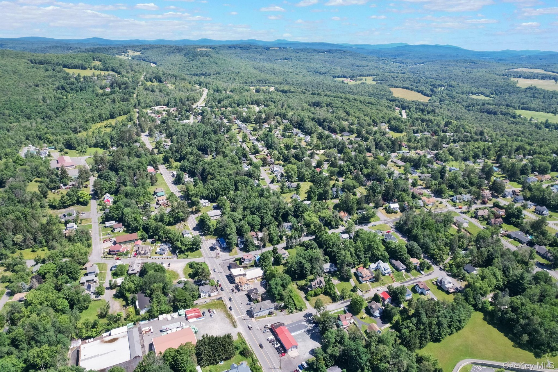 View of property location with nearby suburban area