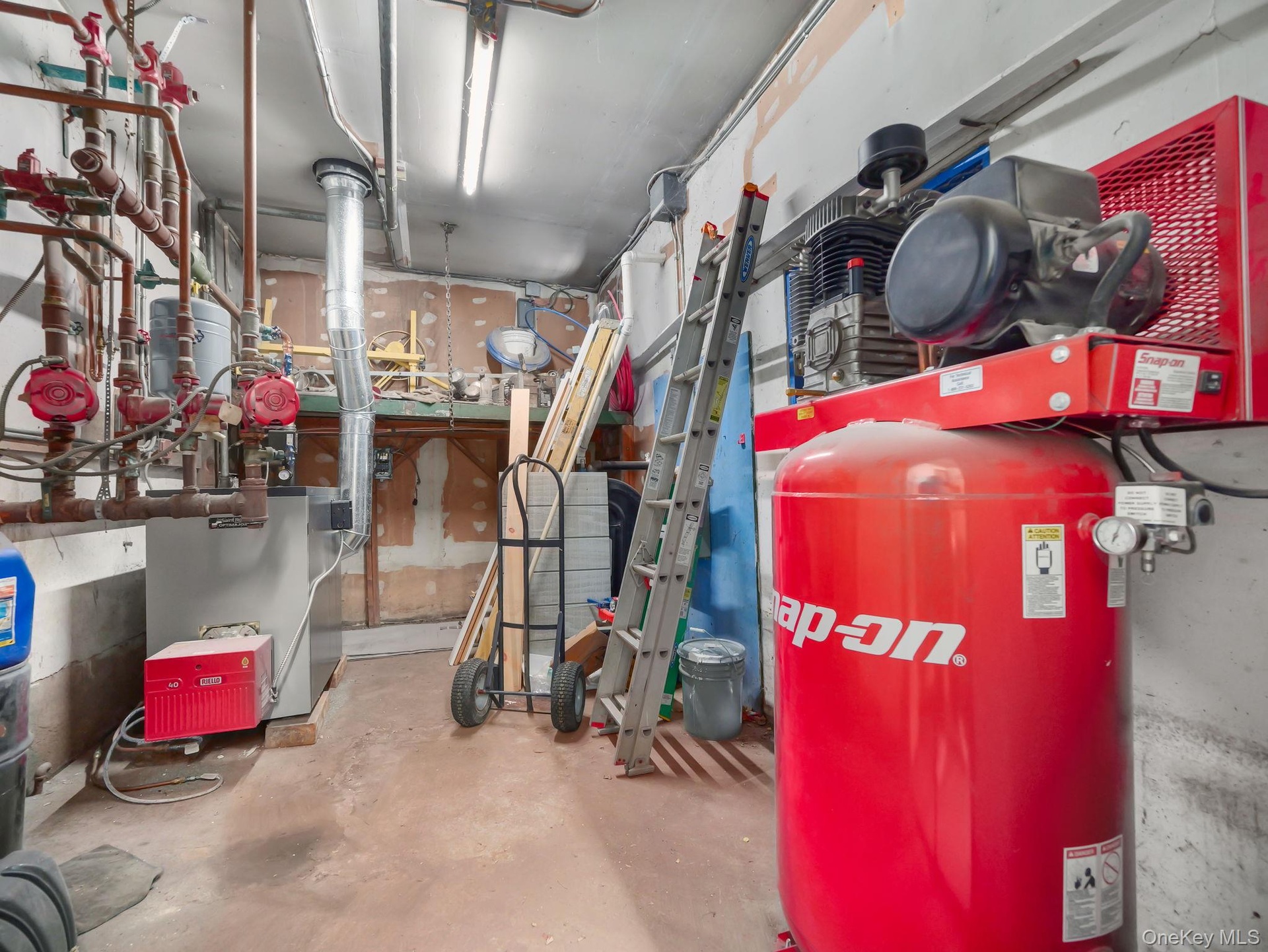 Utility room featuring a heating unit