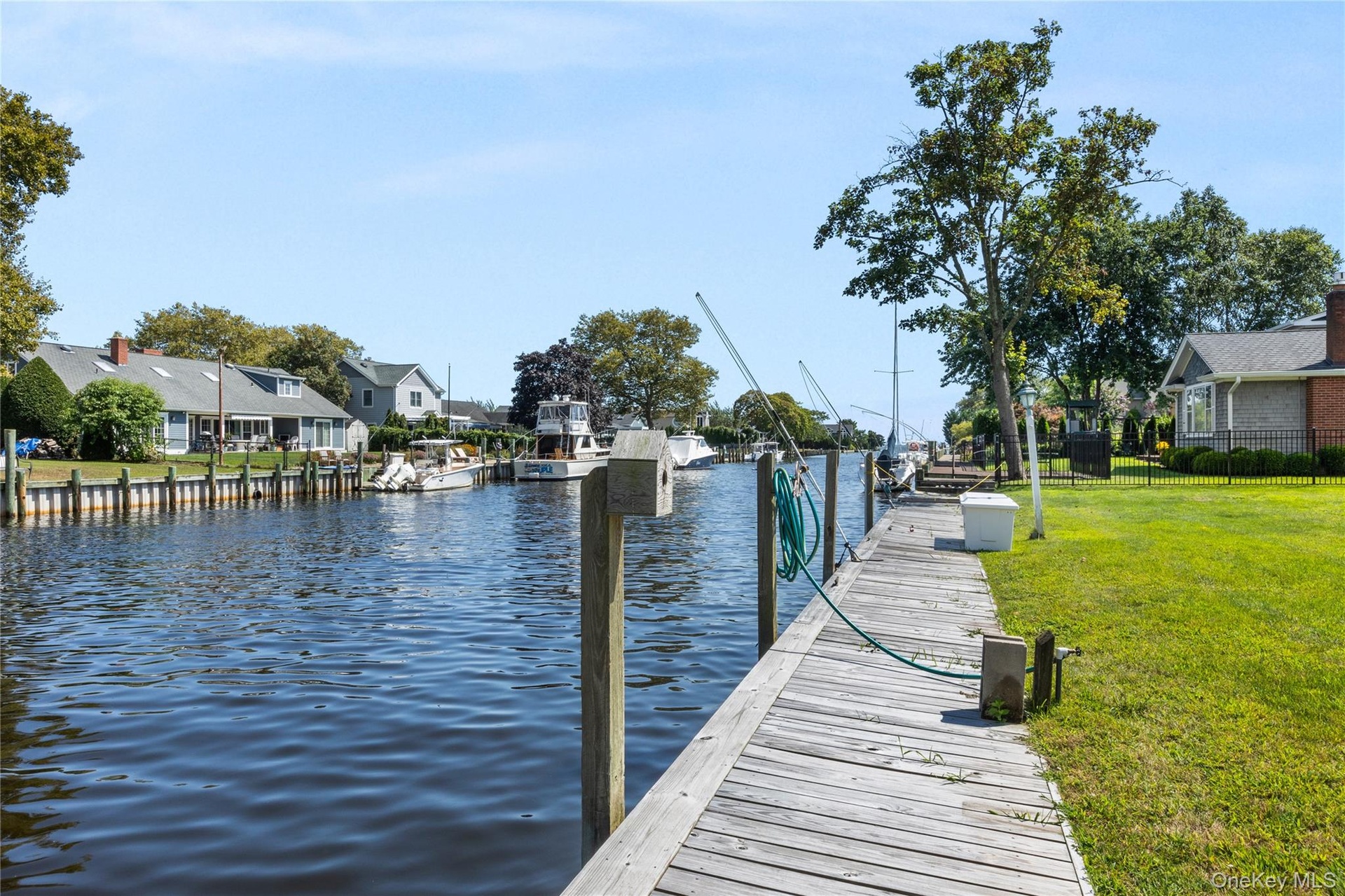 Dock featuring a residential view and a water view