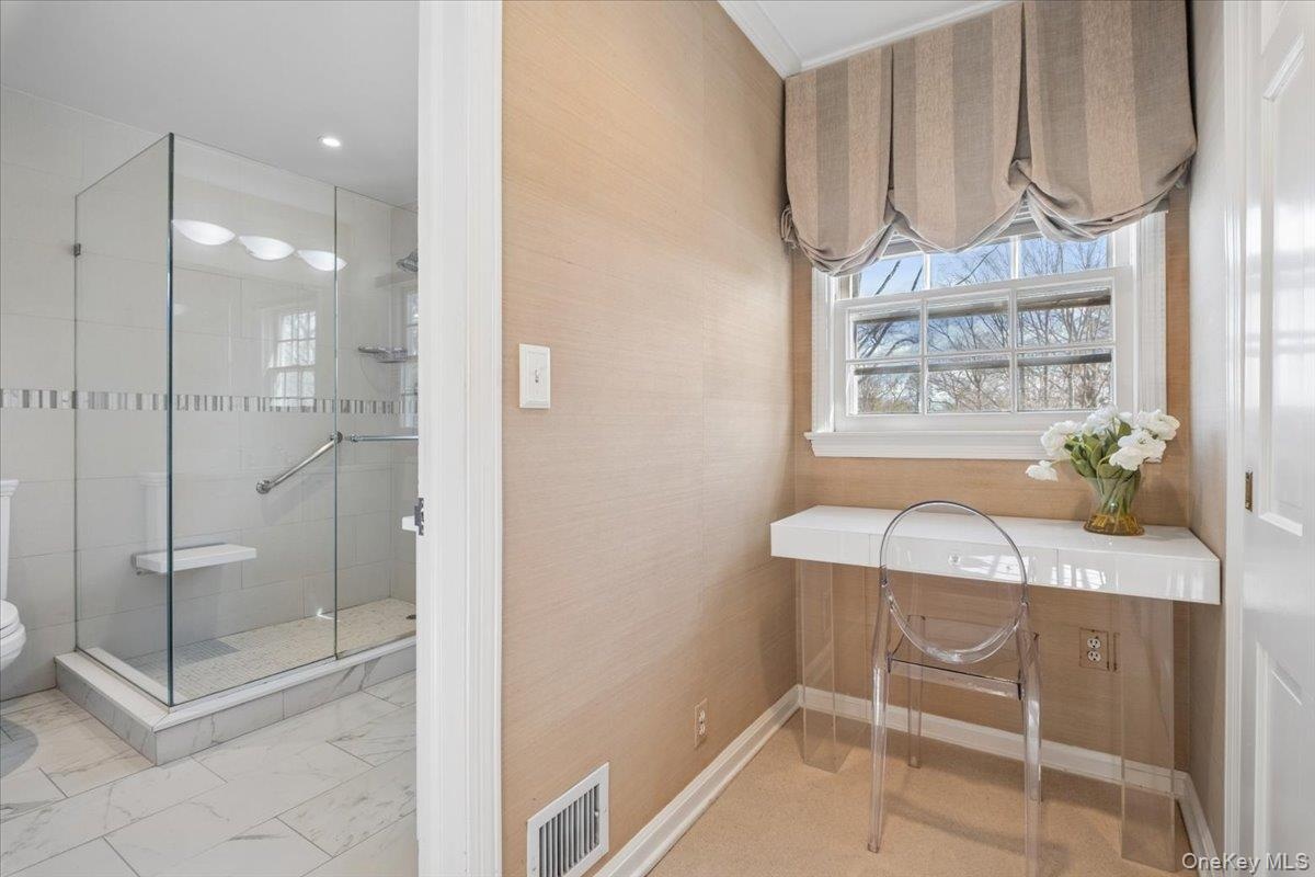 Vanity area adjacent to primary bathroom