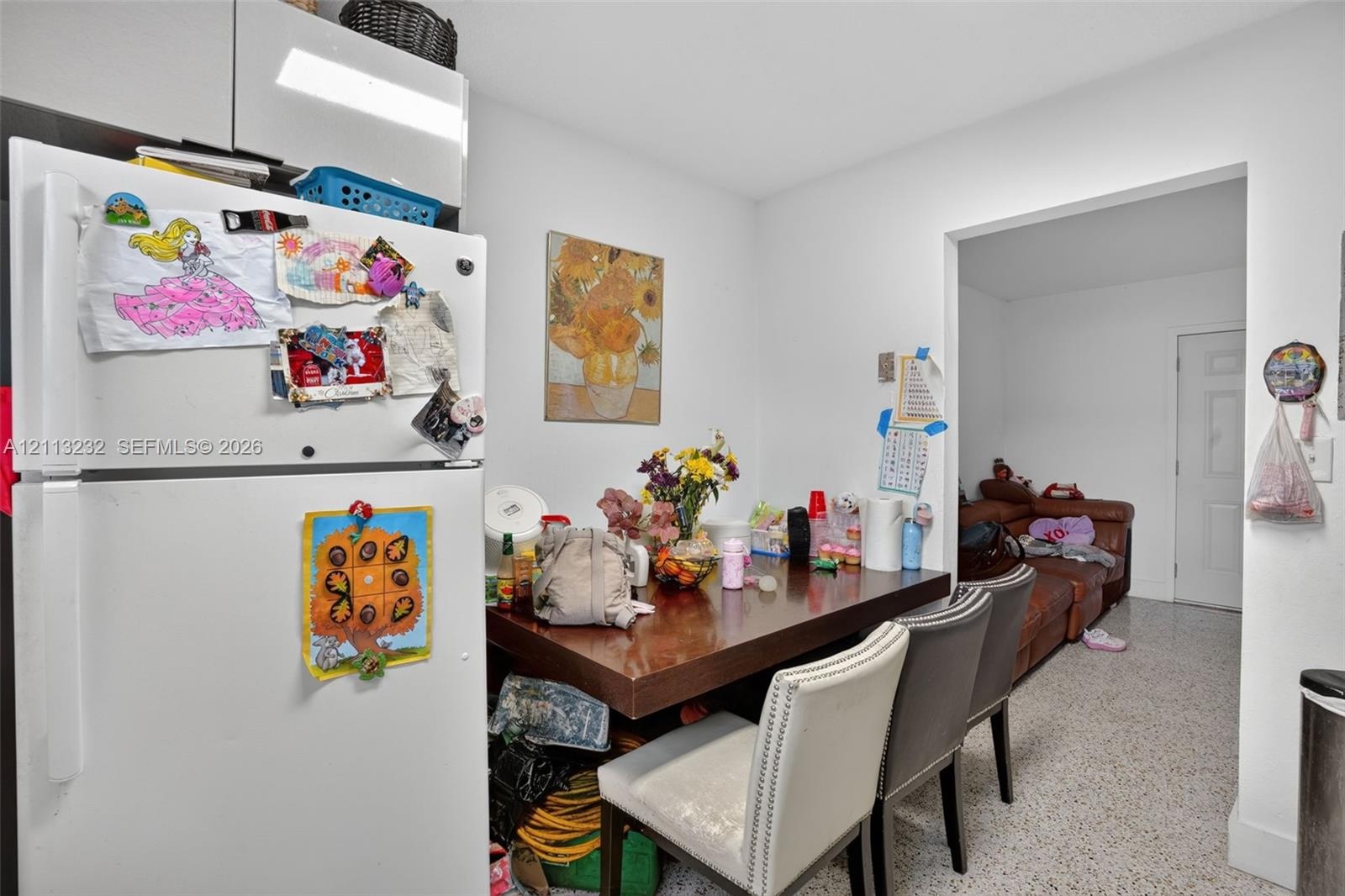Kitchen featuring white cabinetry and terrazzo flooring