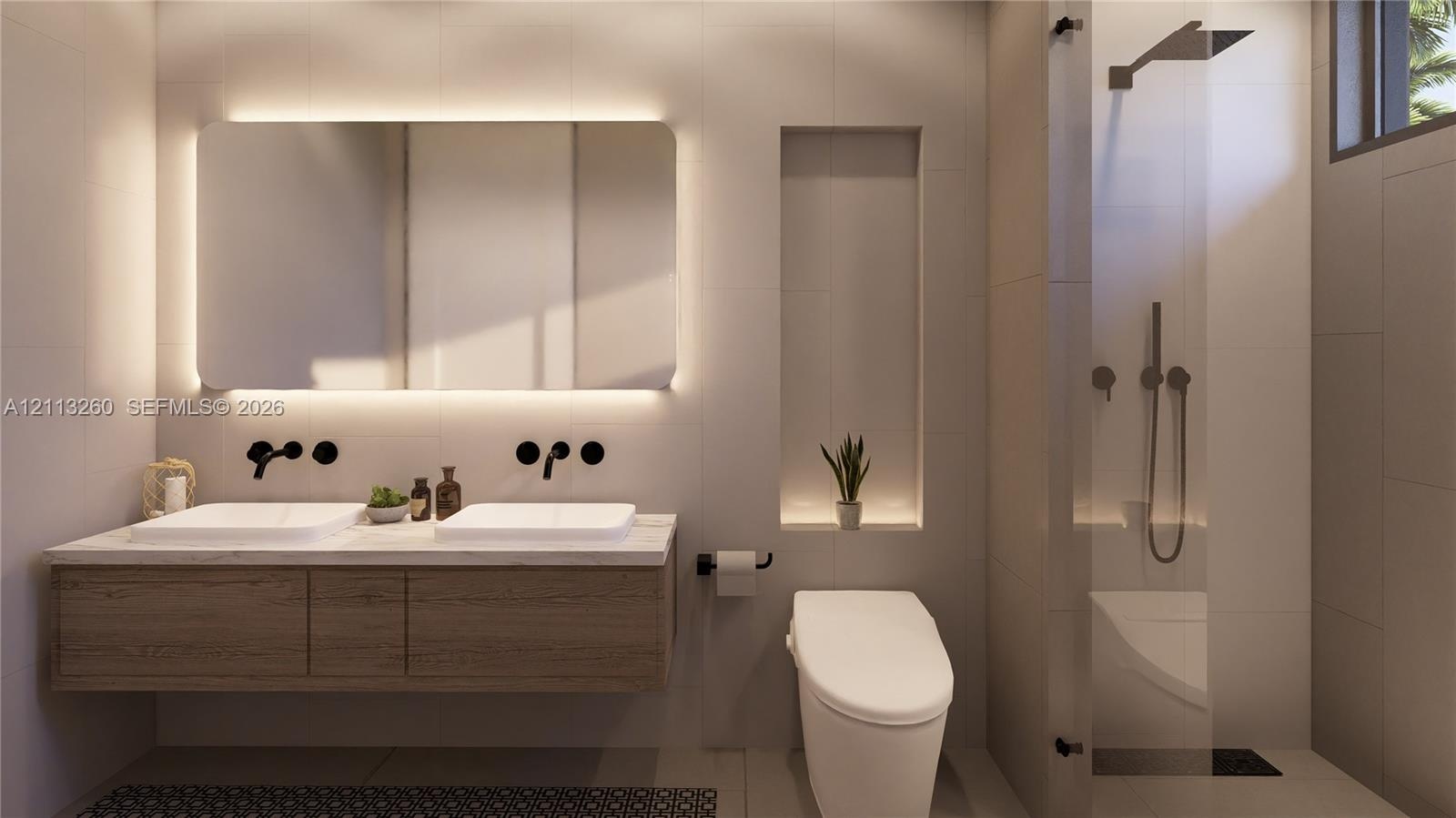 Floating dual-sink vanity with matte black wall-mounted faucets, large LED-backlit mirror, recessed wall niche, and glass-enclosed shower with matte b