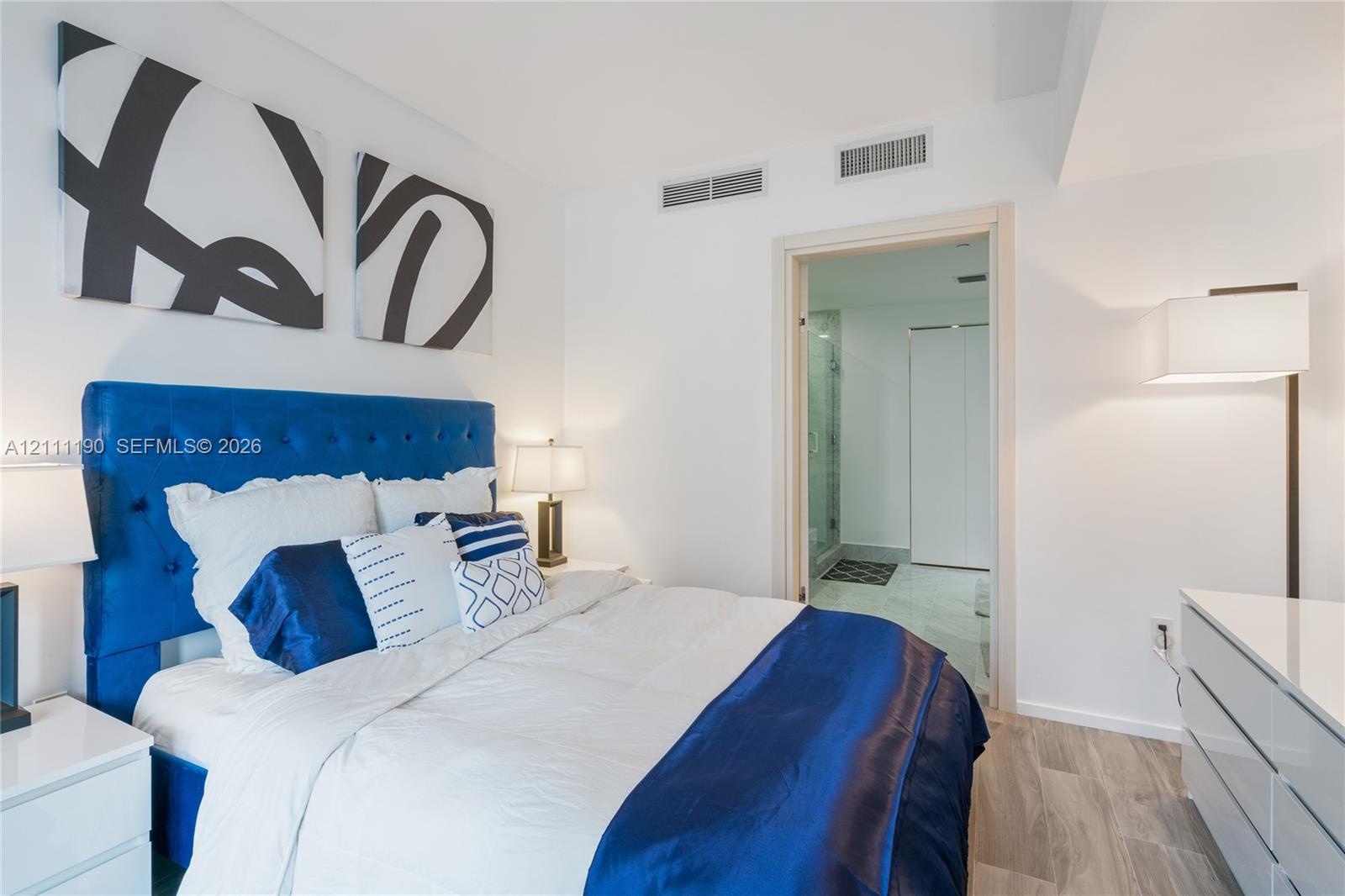 Neutral-toned walls paired with wood-finish flooring