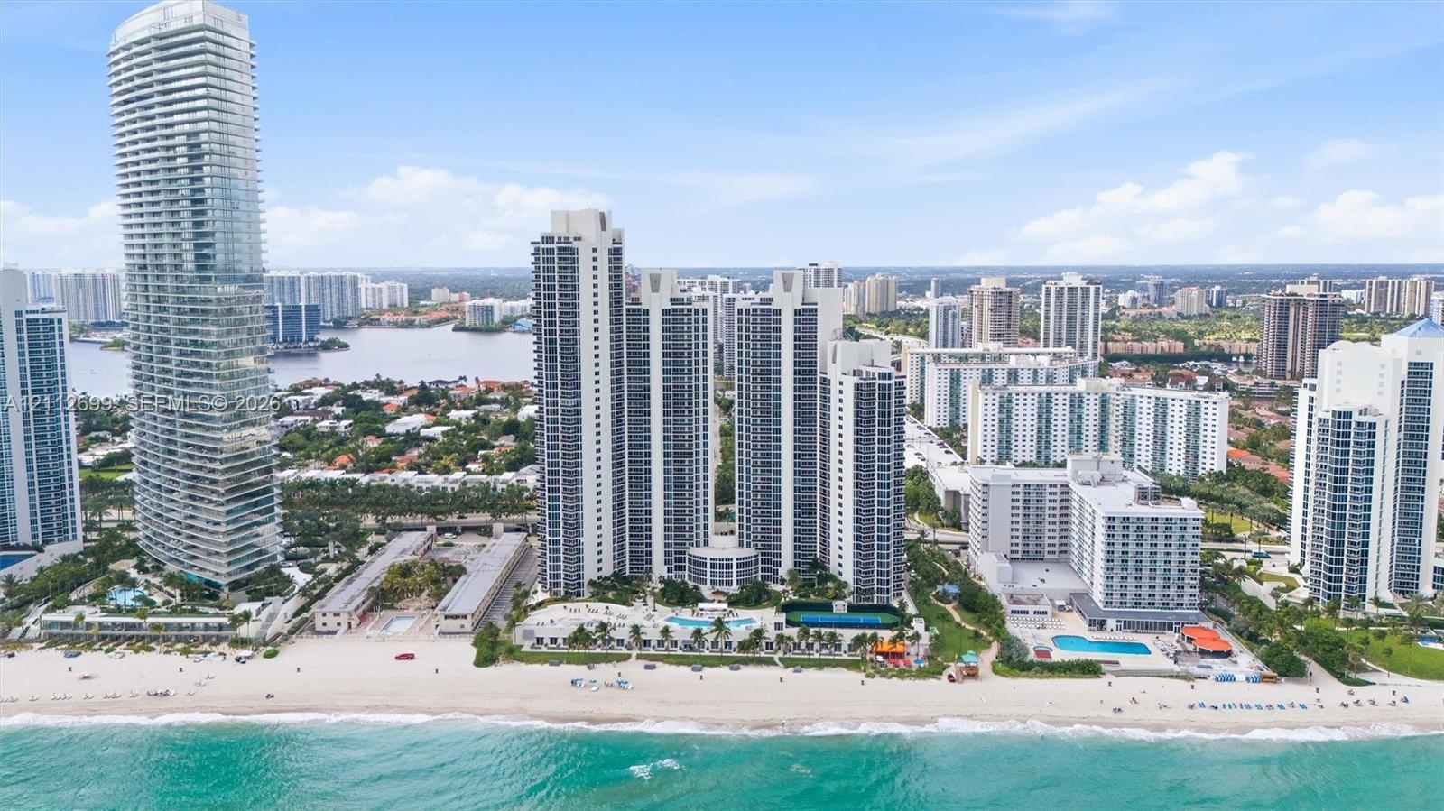 High-rise coastal towers featuring direct beach access, multiple outdoor swimming pools, expansive sun decks, and proximity to inland waterways