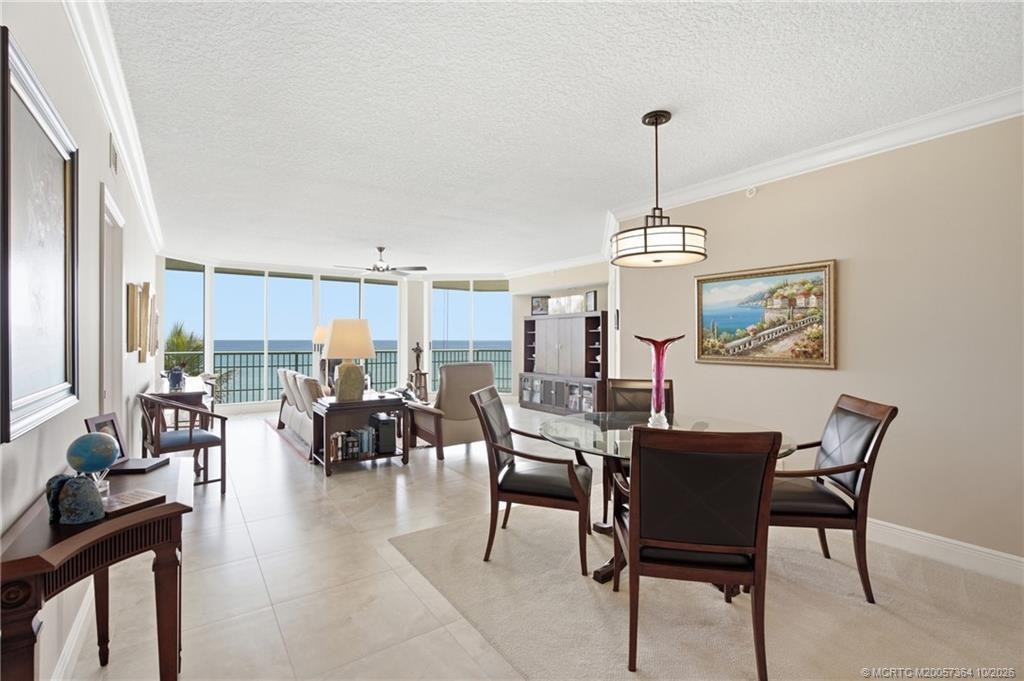 Open-concept living and dining spaces offer comfortable coastal living with plenty of natural light.