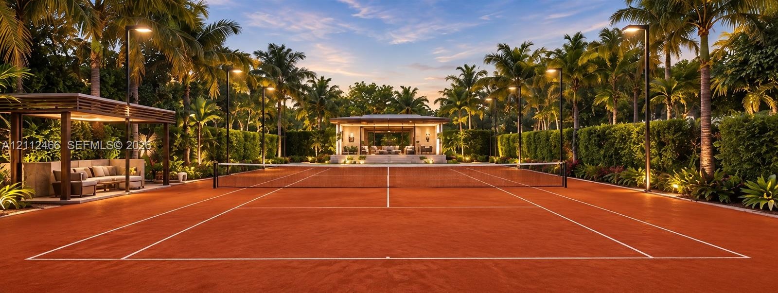 Professional-grade clay tennis court featuring perimeter post lighting, a private covered viewing pavilion, mature perimeter landscaping, and a detach