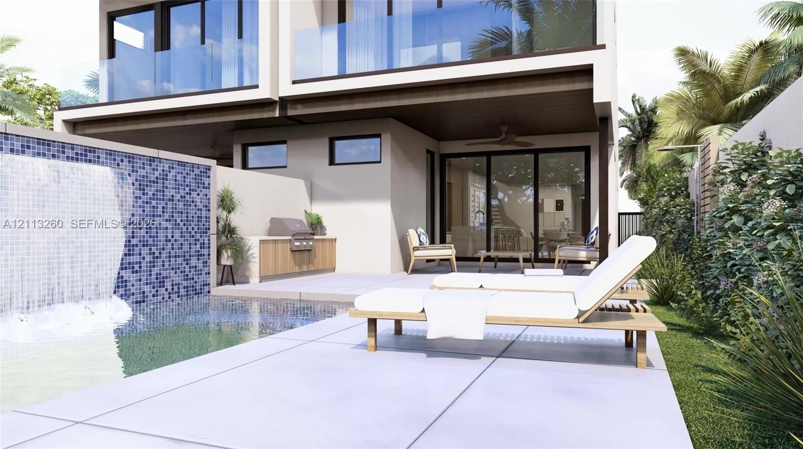 Outdoor living area featuring a swimming pool with a mosaic tile water feature, built-in outdoor kitchen, concrete patio, glass-panel railings, and sl