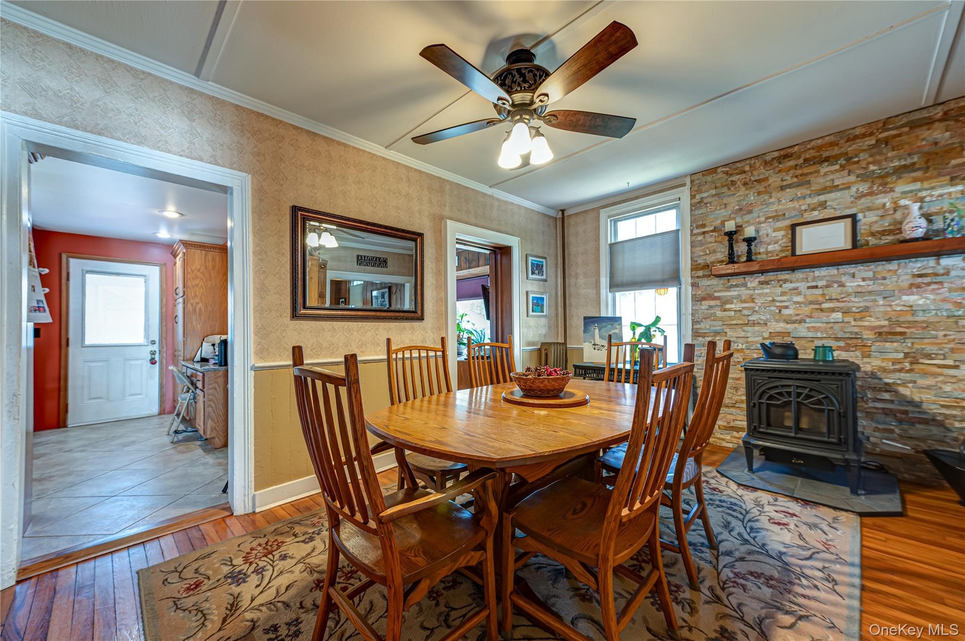Formal Dining Room, wood flooring, pellet stove, gorgeous stone wall