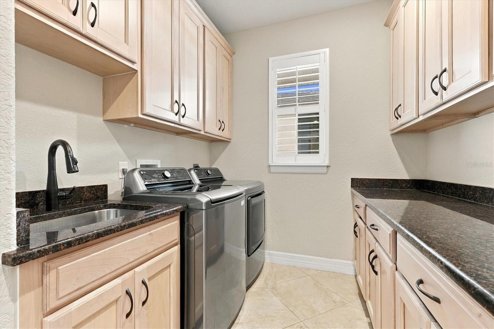 Laundry Room with Sink and Cabinets