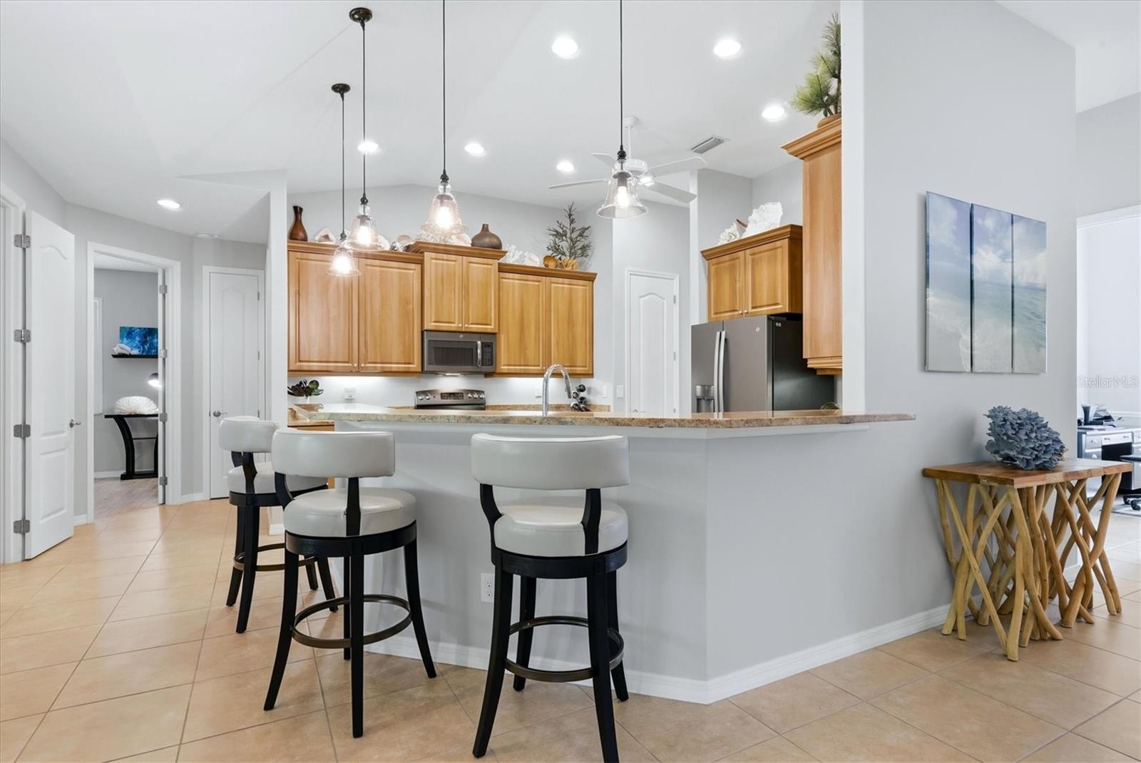 Kitchen has a breakfast bar with additional seating