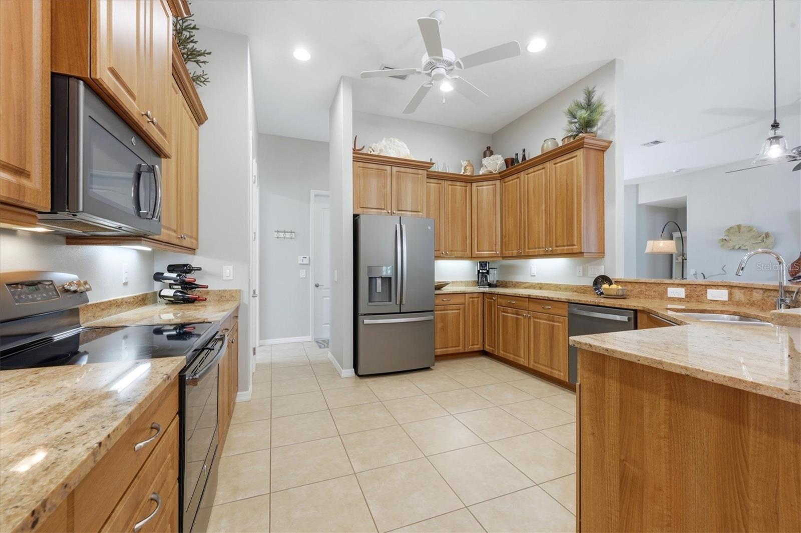 Spacious Kitchen is complimented with granite & stainless appliances