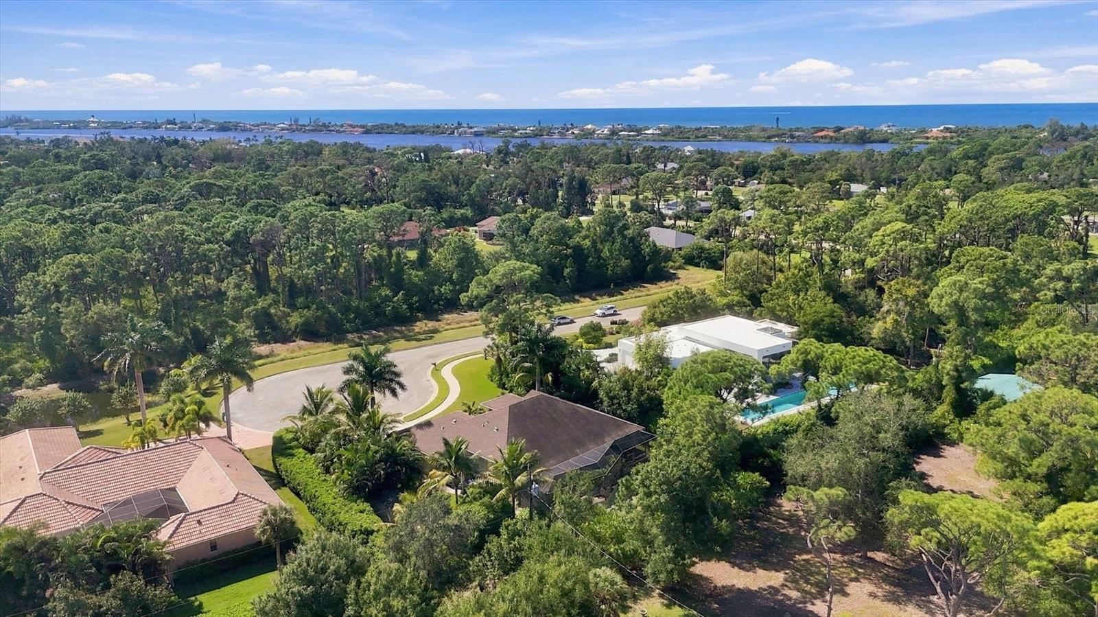 Situated on a cul-de-sac with a non-buildable privacy easement directly across the street & just 1 mile from Manasota Key Beach