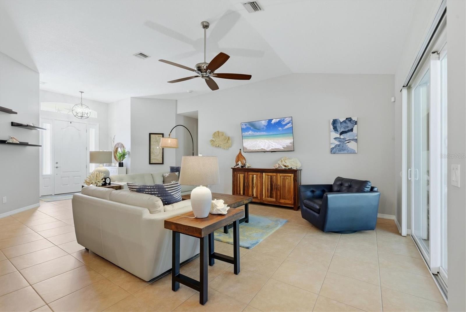 Living Room flows onto the paver lanai