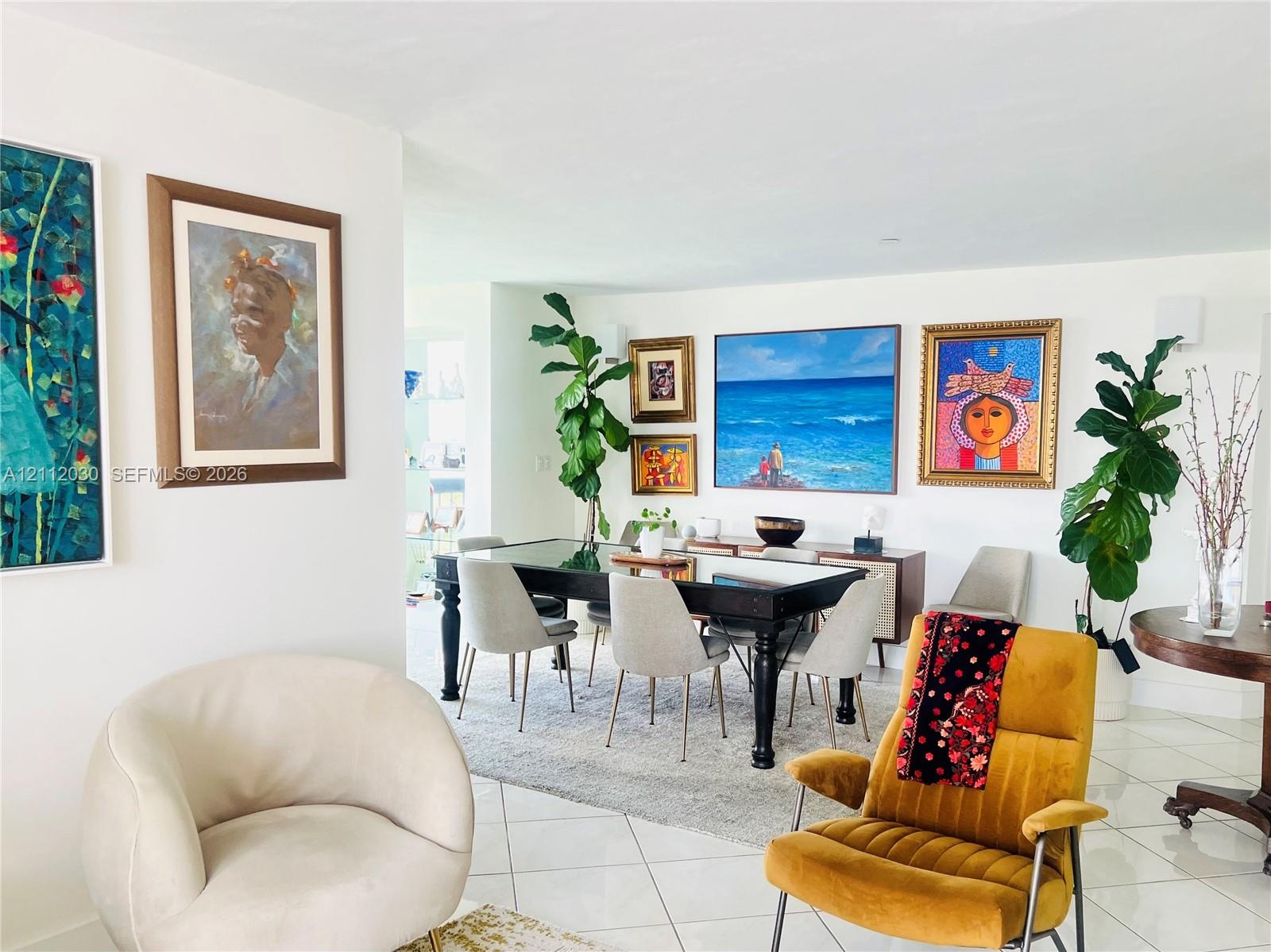 Open-concept interior featuring light-toned ceramic tile flooring and smooth-finish walls