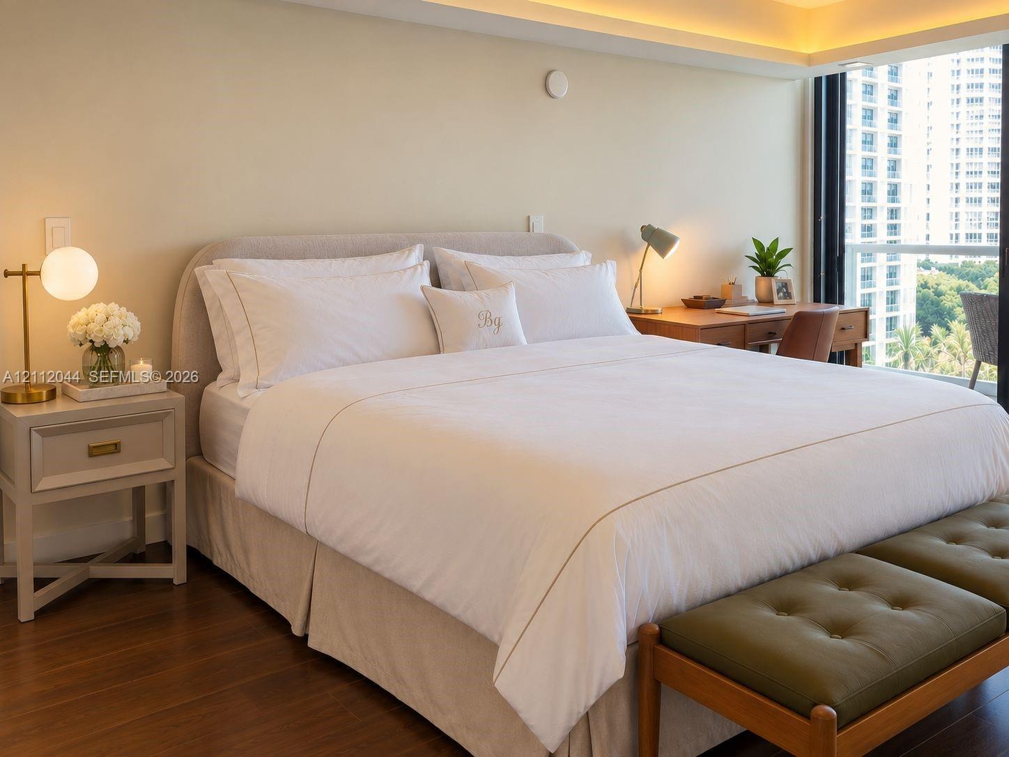 Expansive floor-to-ceiling glass window, recessed ceiling lighting, and dark wood-finish flooring