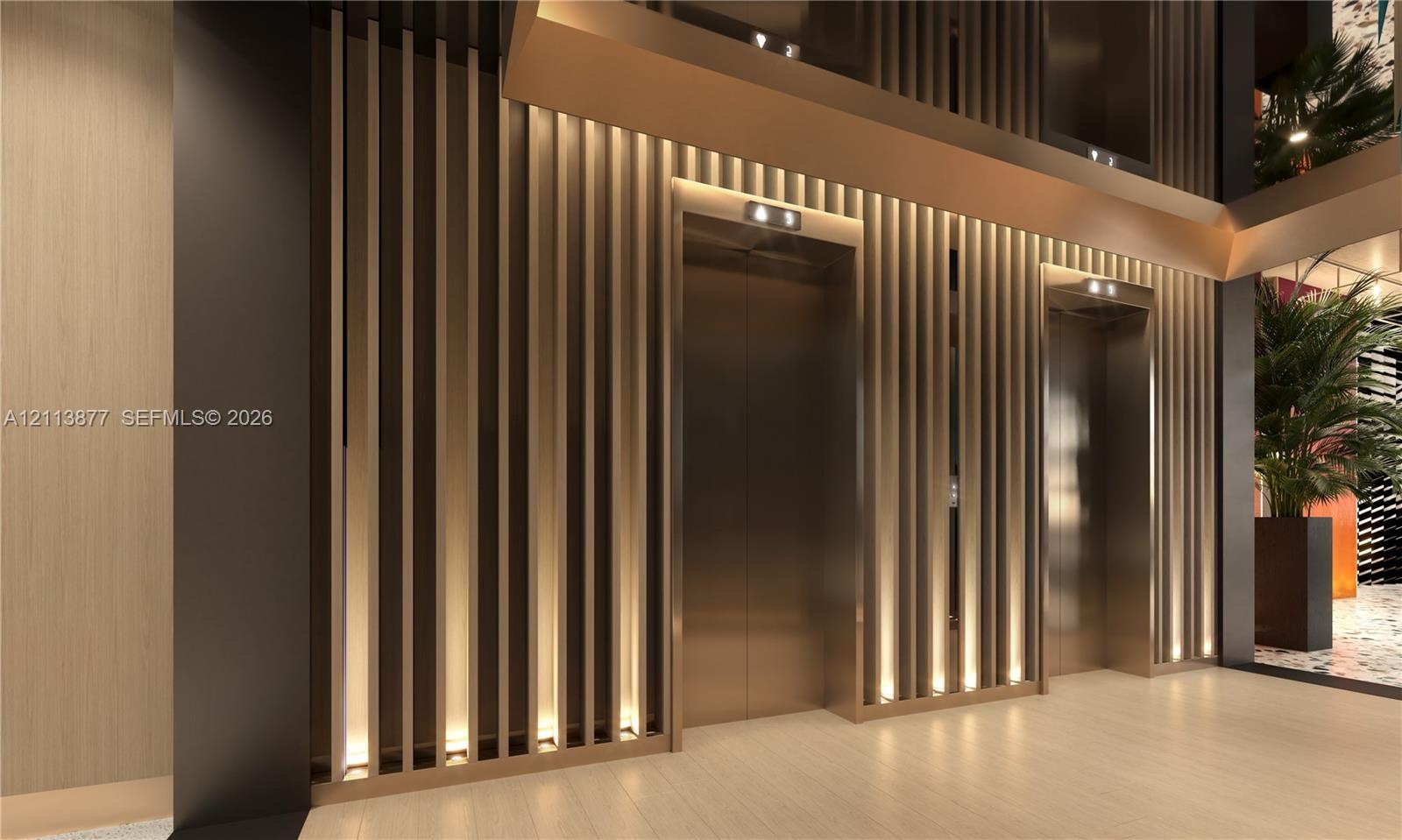 Floor-to-ceiling slatted wall paneling with integrated vertical accent lighting, metallic elevator doors, and neutral wide-plank flooring